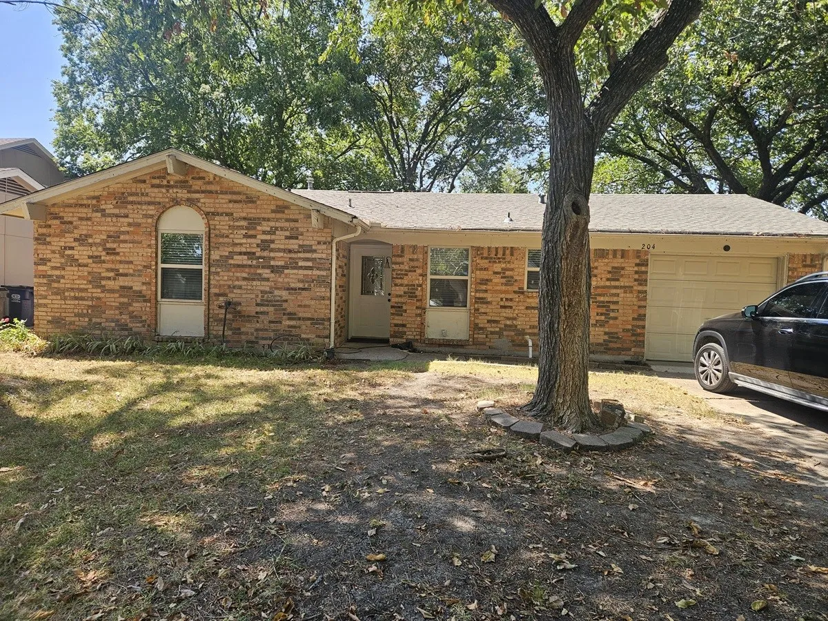 Brick exterior featuring a gabled roofline