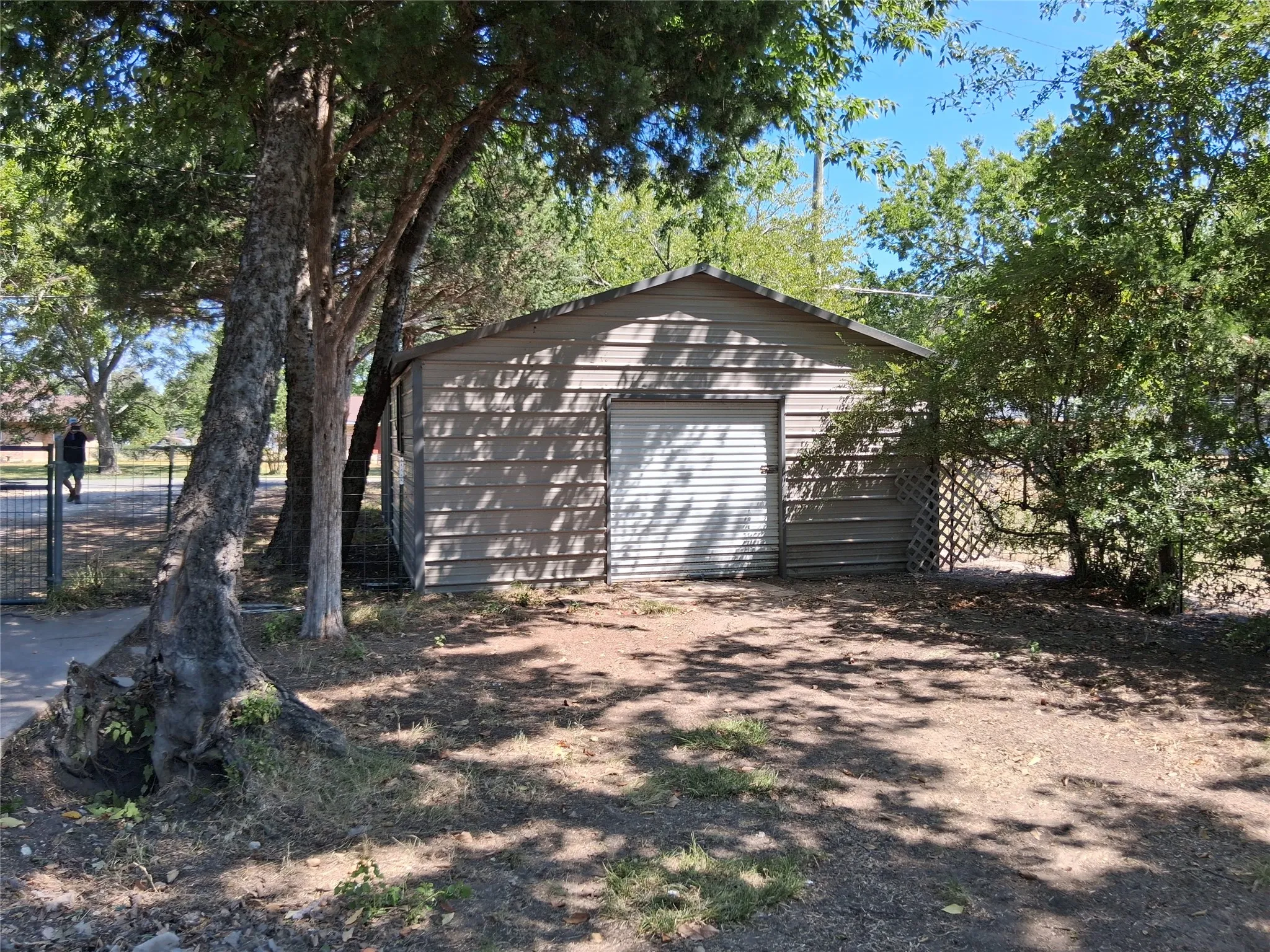 Carport with shed