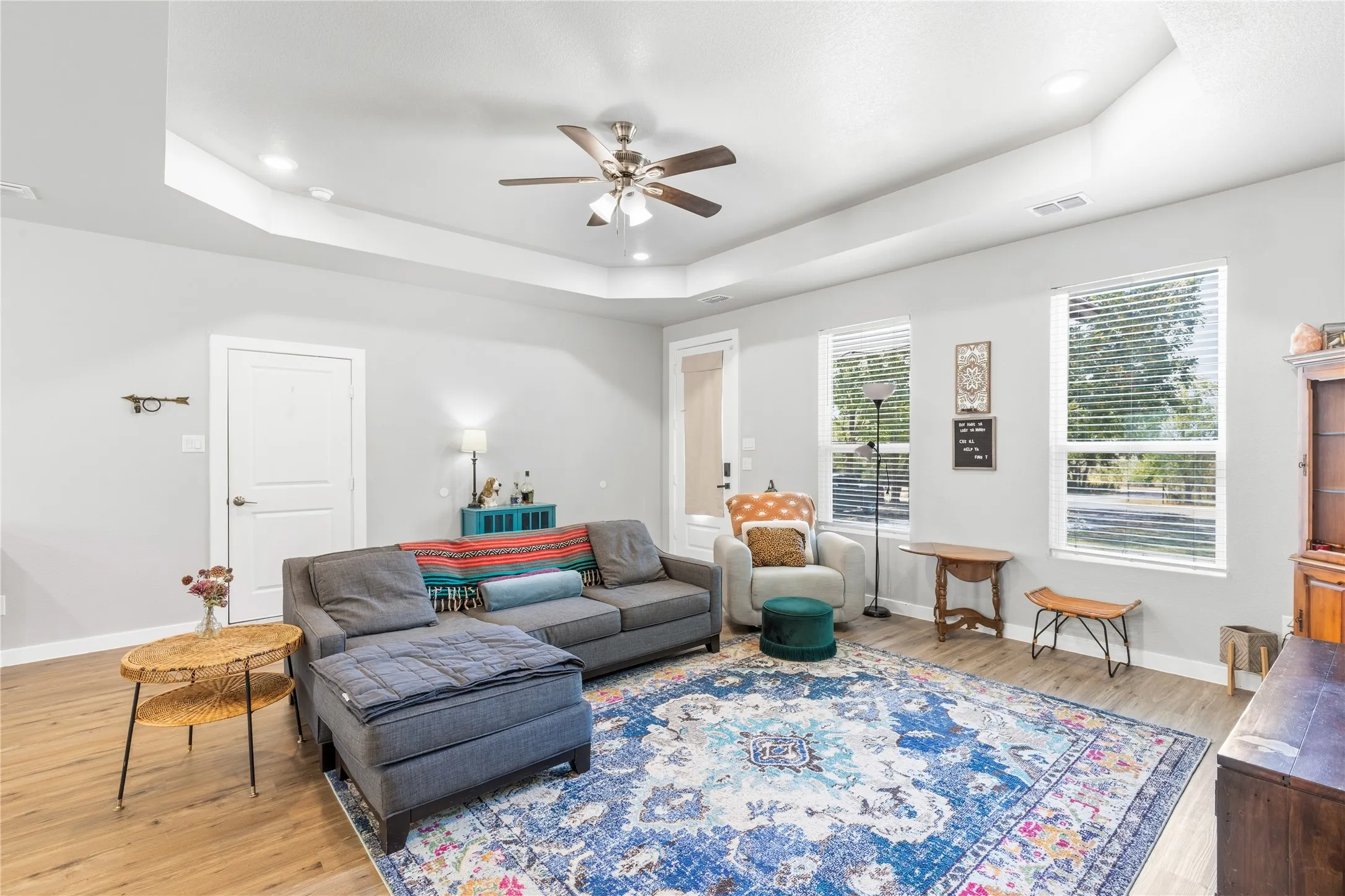 Tray ceiling with recessed lighting and a ceiling fan