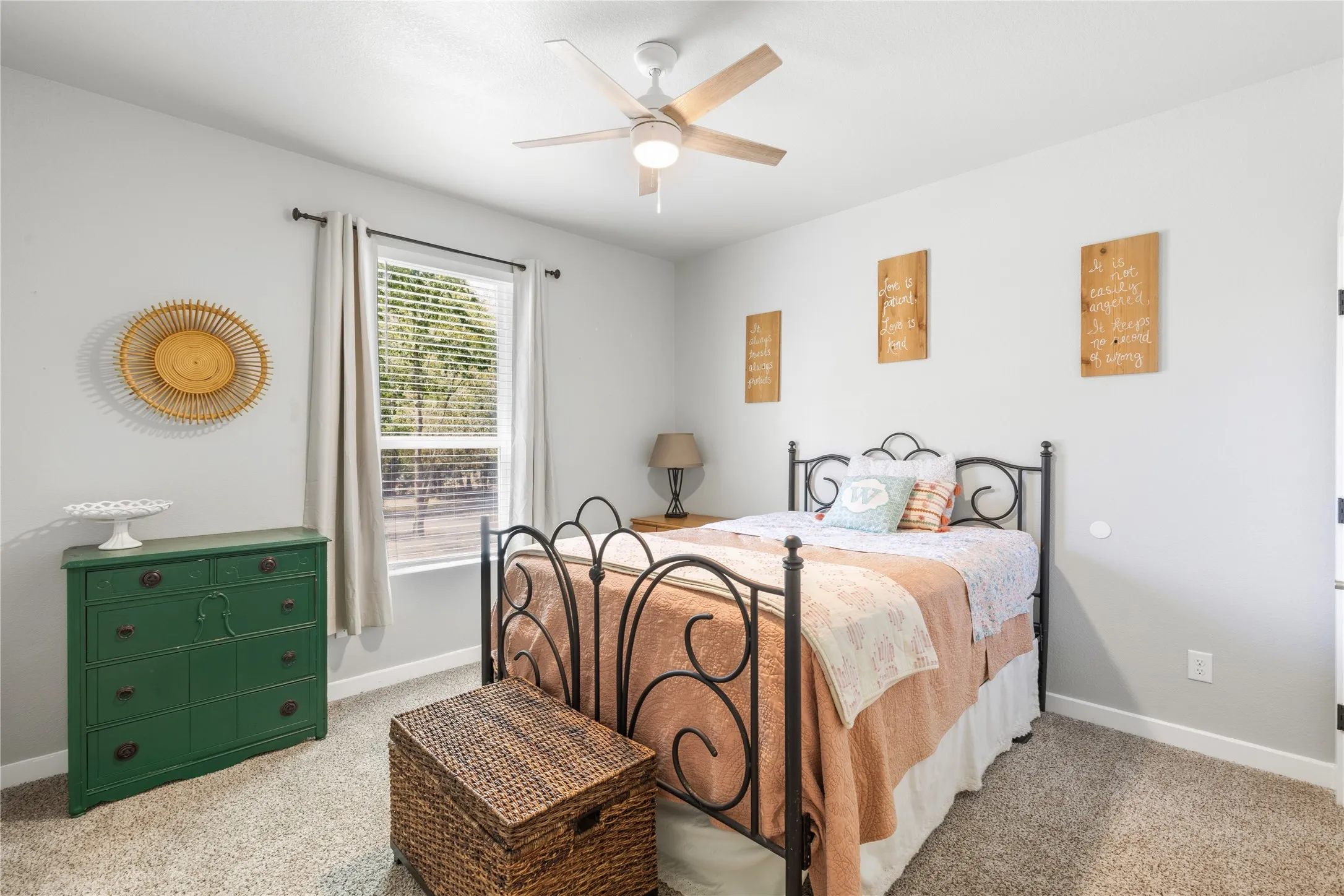 Carpeted room with a ceiling fan, window with blinds, and white painted walls