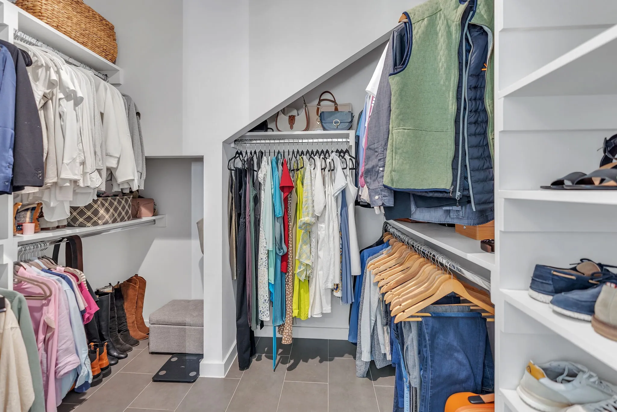 White built-in shelving and hanging rods