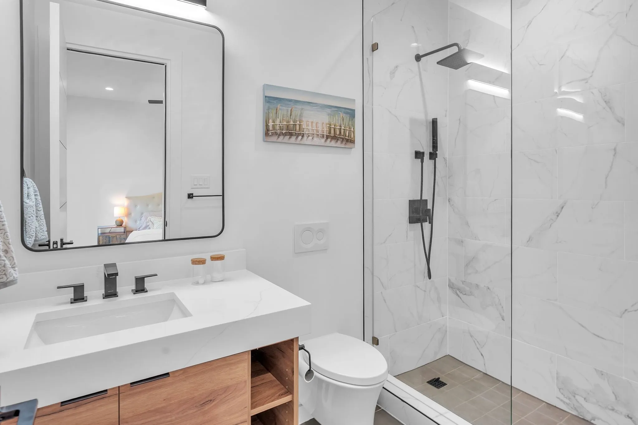 Ensuite Bathroom, Modern vanity with an integrated rectangular sink, matte black fixtures, and wood-finish cabinetry