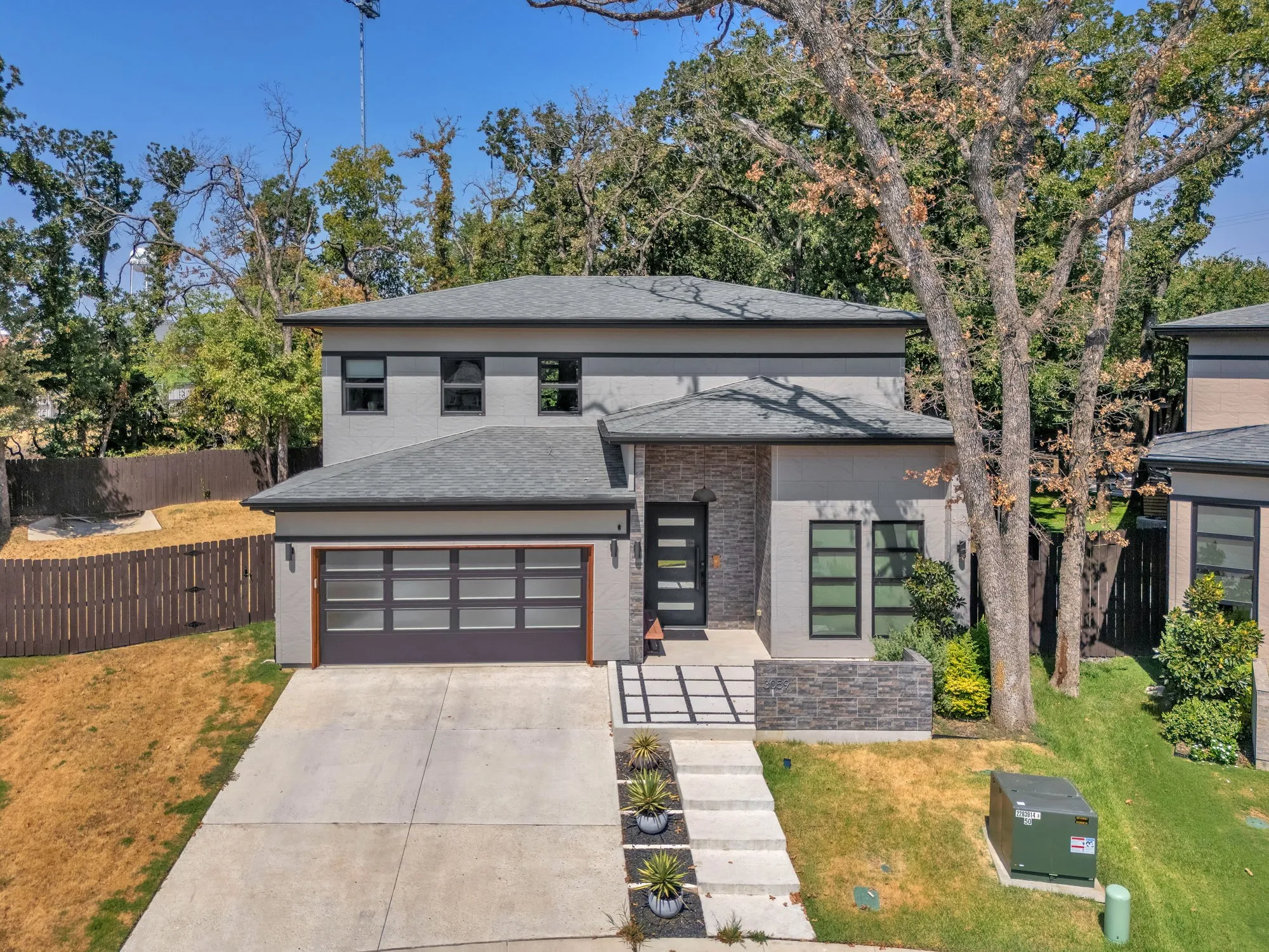 Welcome to 3059 Tall Oaks Court where modern contemporary design meets soft natural interior to create an oasis