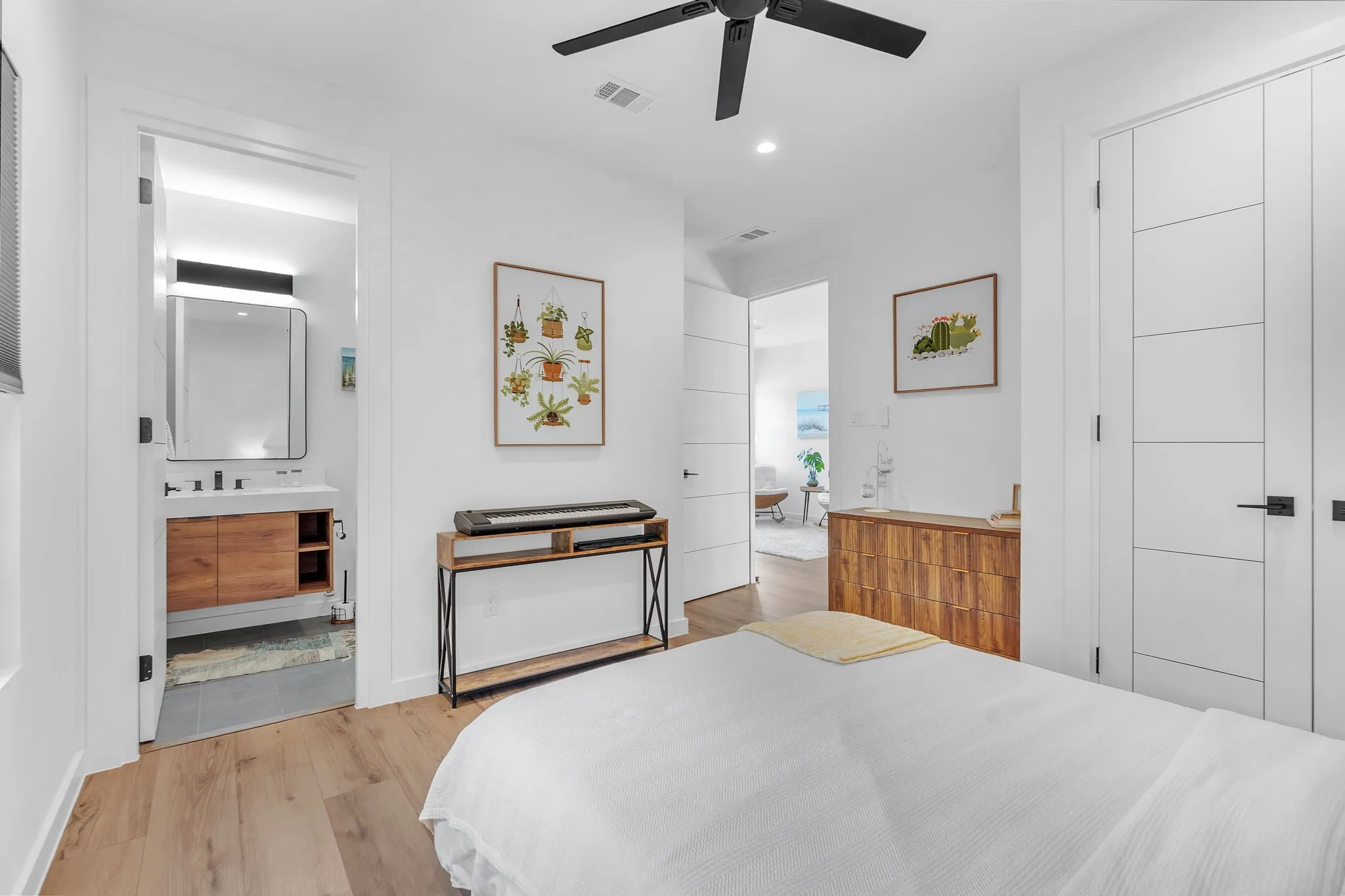 Ensuite Bathroom, Wood-finish flooring, recessed lighting, and a ceiling fan