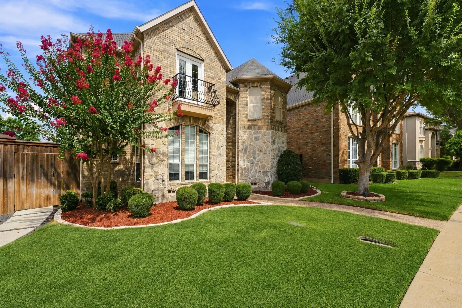 Stone and brick exterior with a turret feature