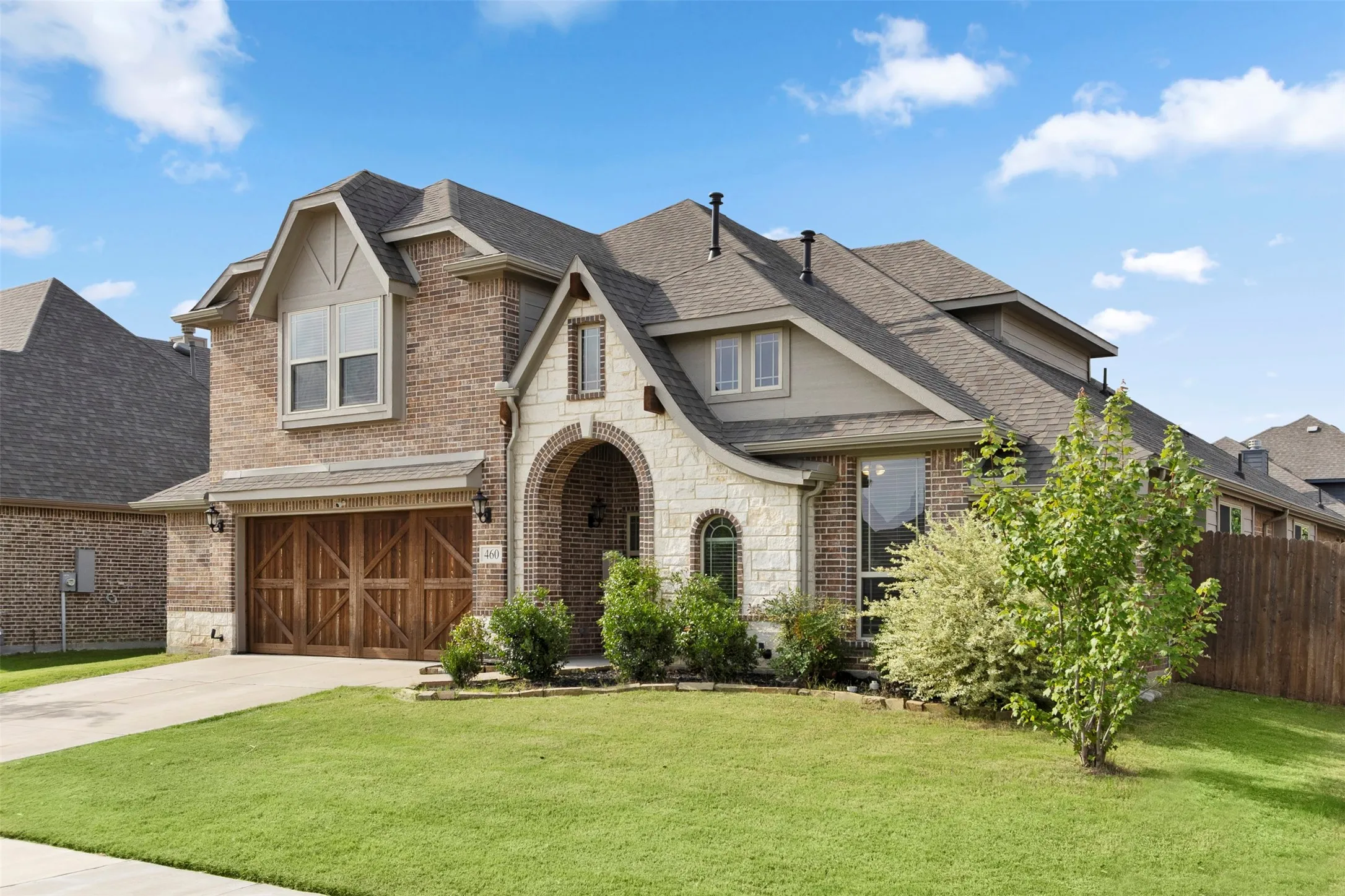 Brick and stone exterior with arched entry
