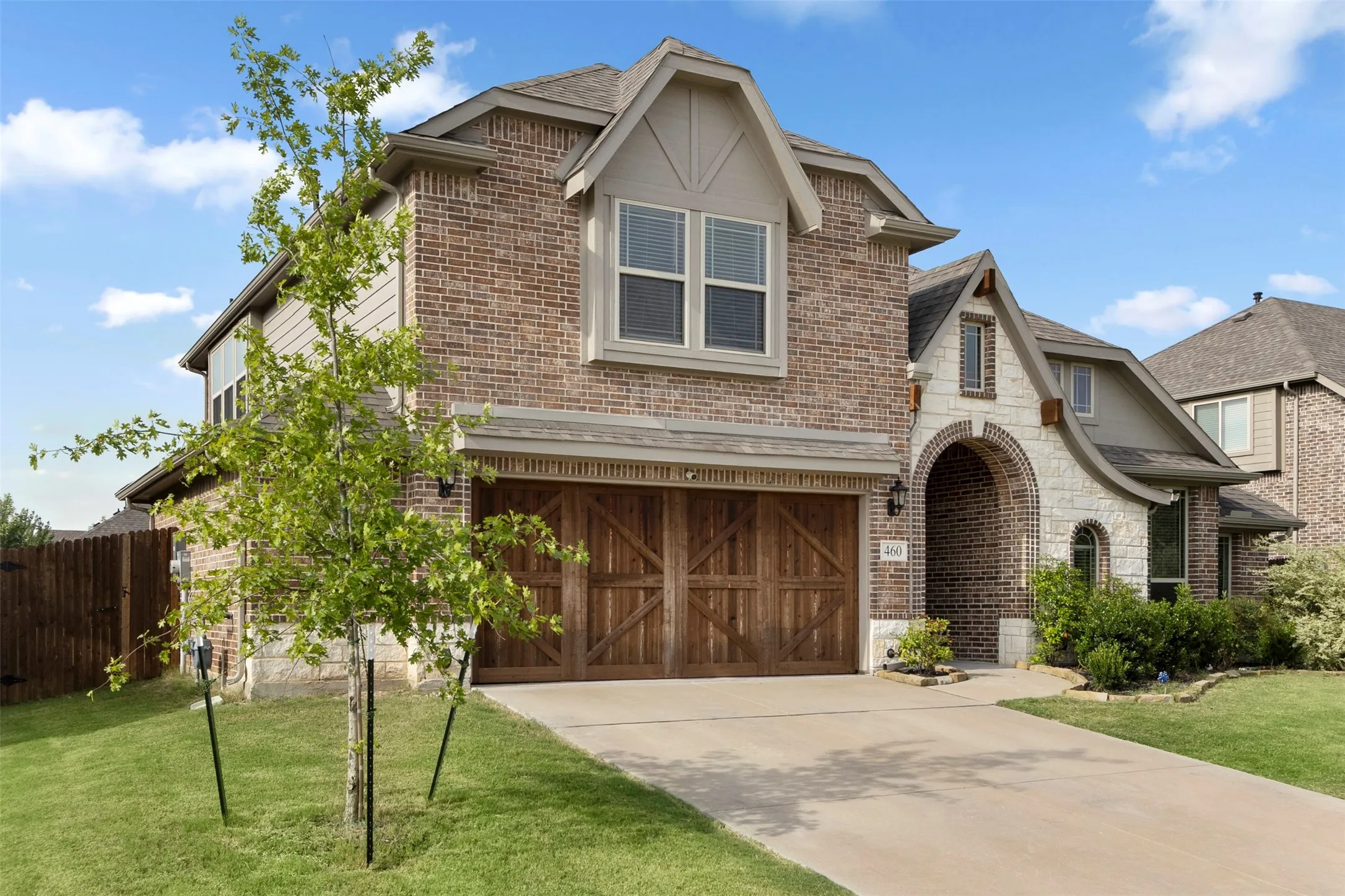 Brick and stone exterior with arched entry
