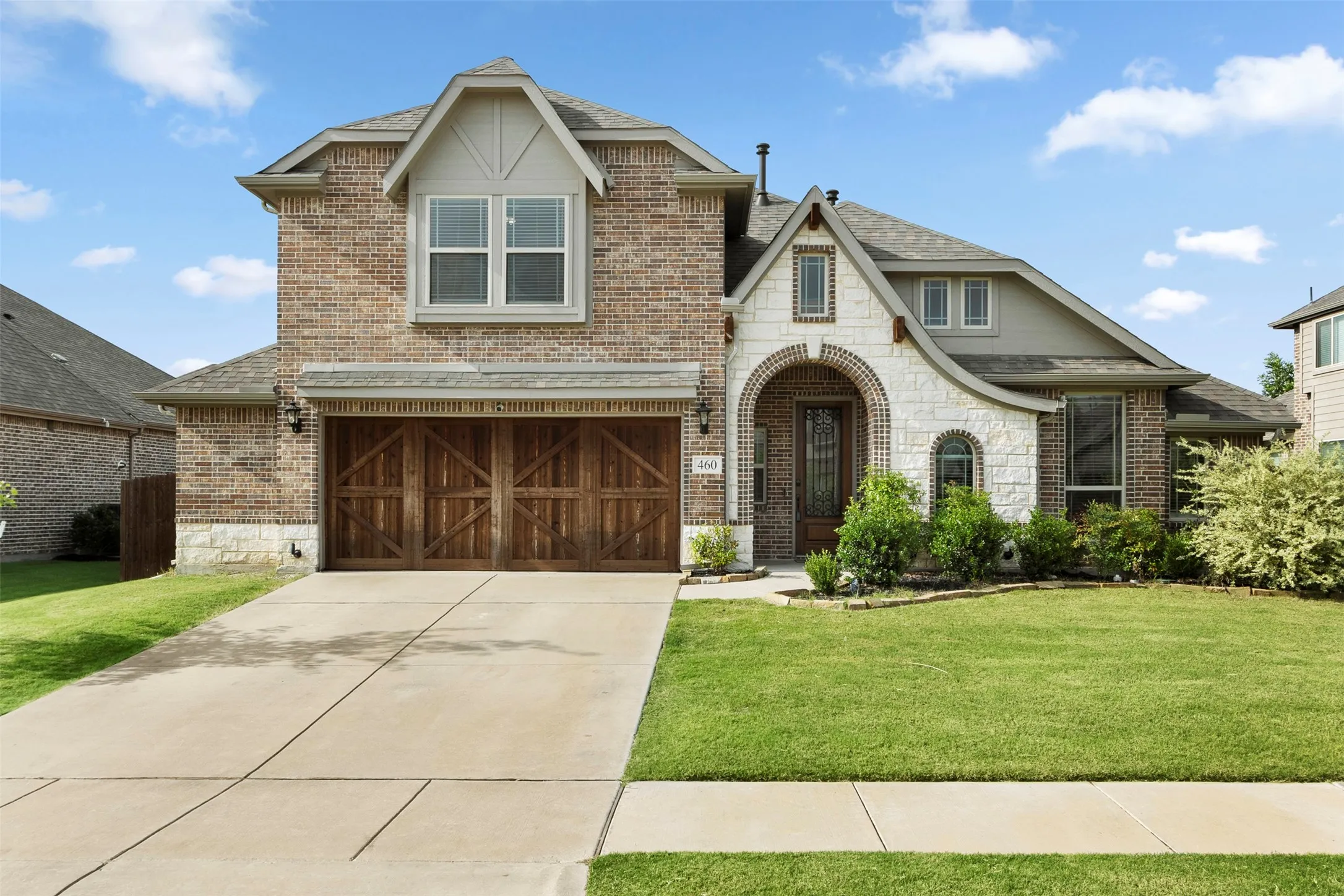 Brick and stone exterior with arched entry
