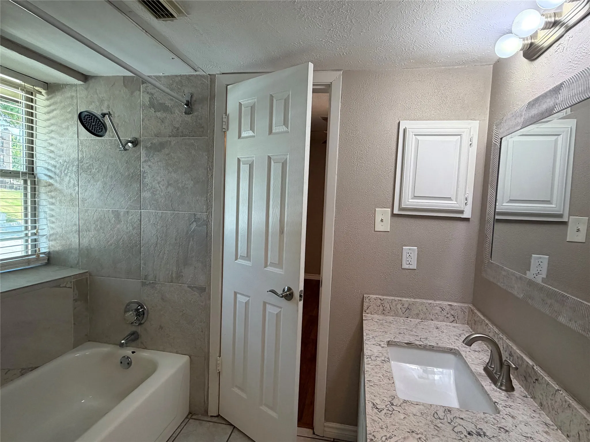 Second Bath with Ensuite Door to Second Bedroom and Main Living