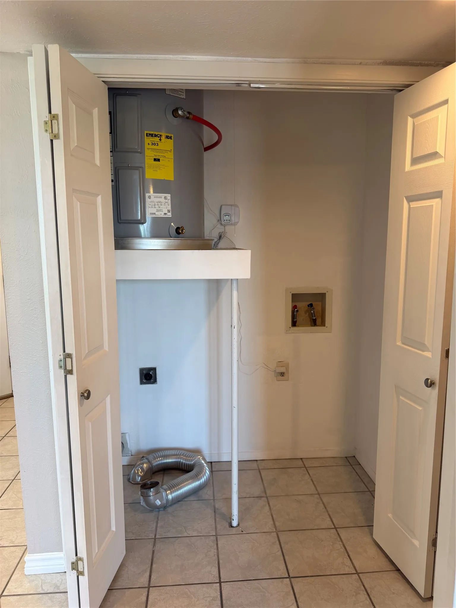 Full Washer and Dryer, Plus Easy Access to Water Heater