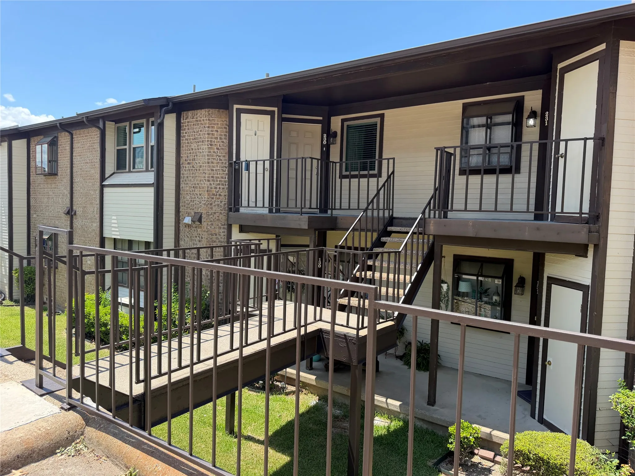 Walkway From Parking Lot with Eight Steps to Upper-Level Condo. 230 Henry M Chandler on the Left. One of Two Storage Closet to the Left of Front Door.