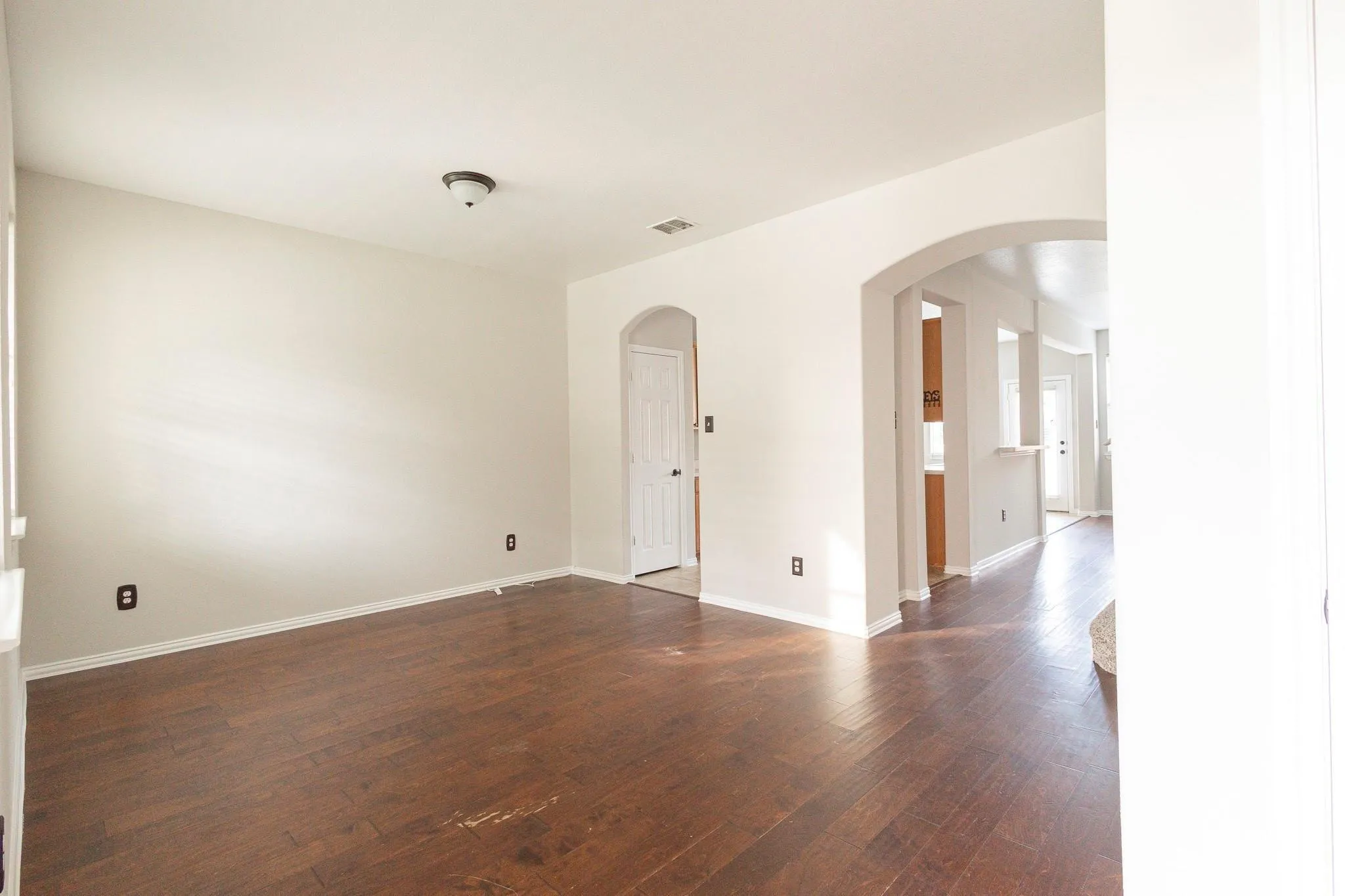 Wood-finish flooring throughout, complemented by a neutral color palette