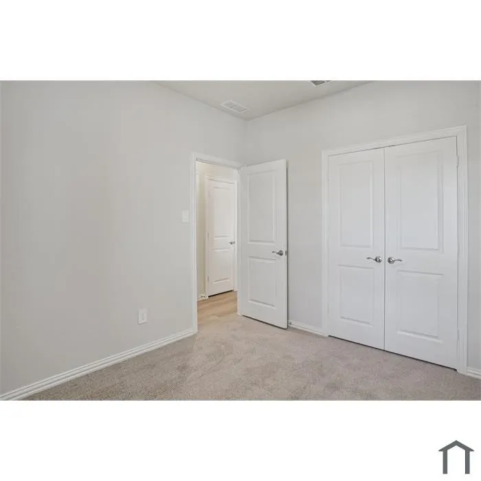Light gray walls with carpeting