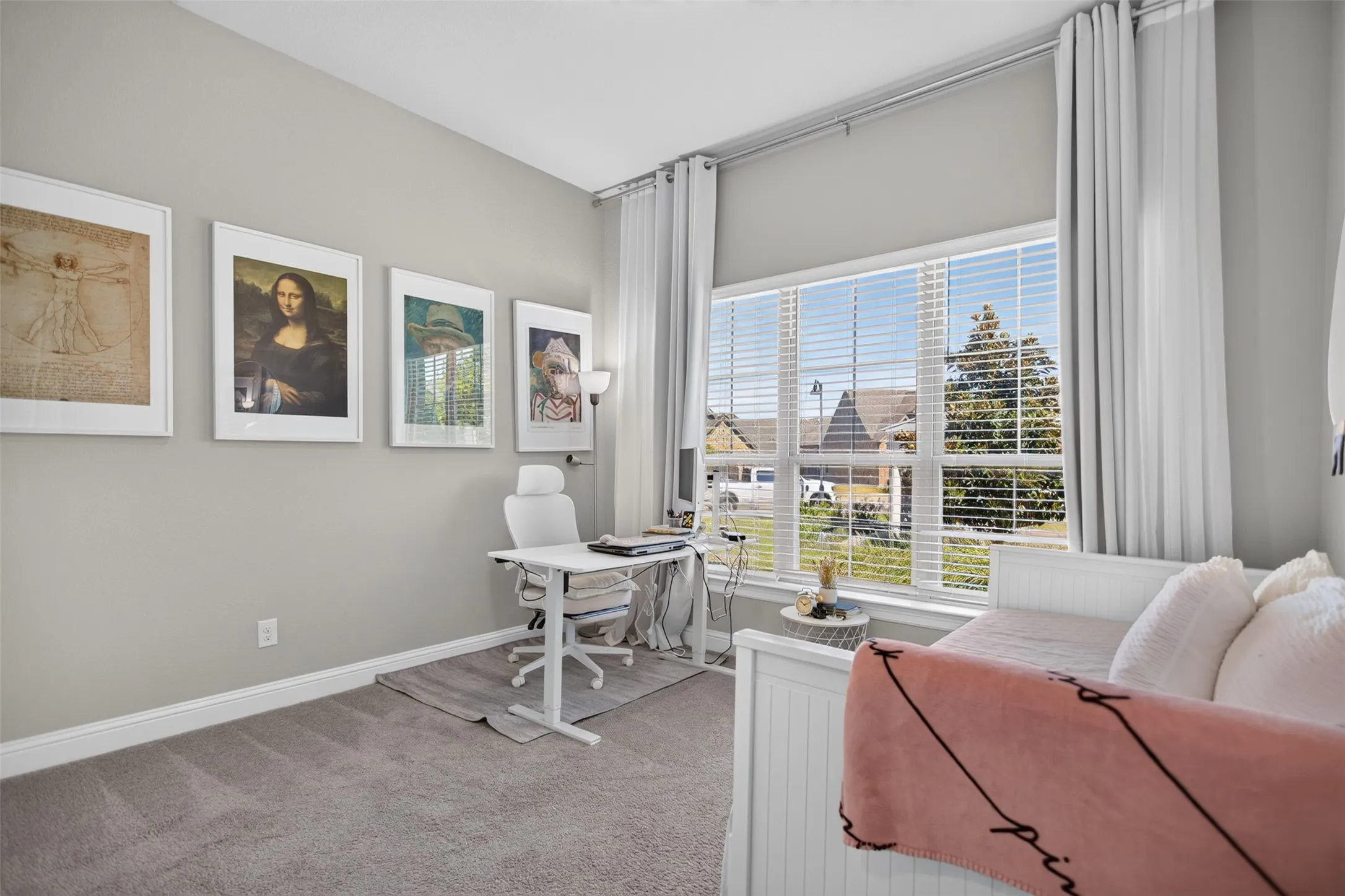 Carpeted room with a large multi-pane window, white window blinds, and full-length curtains