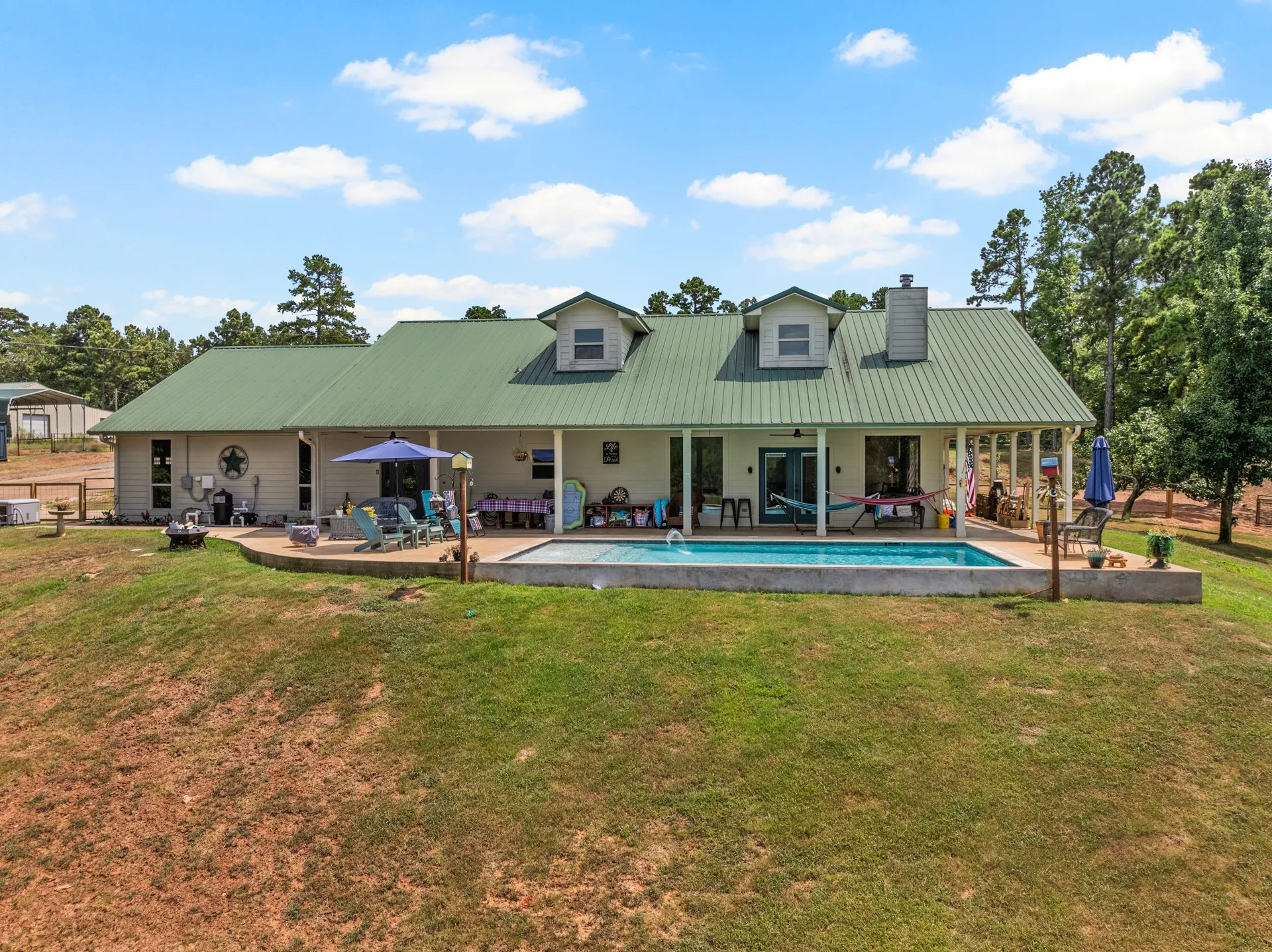 Swimming pool off of main house