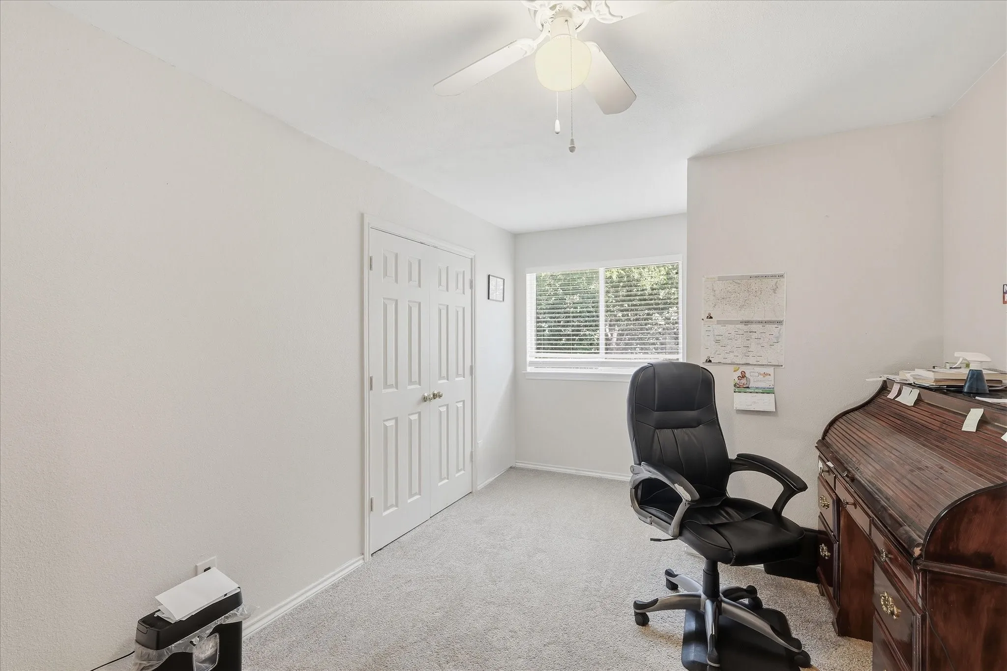 One of three secondary bedrooms, currently used as an office.
