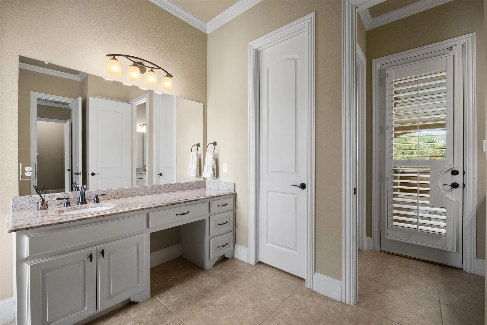 Guest bathroom with back yard/pool access.