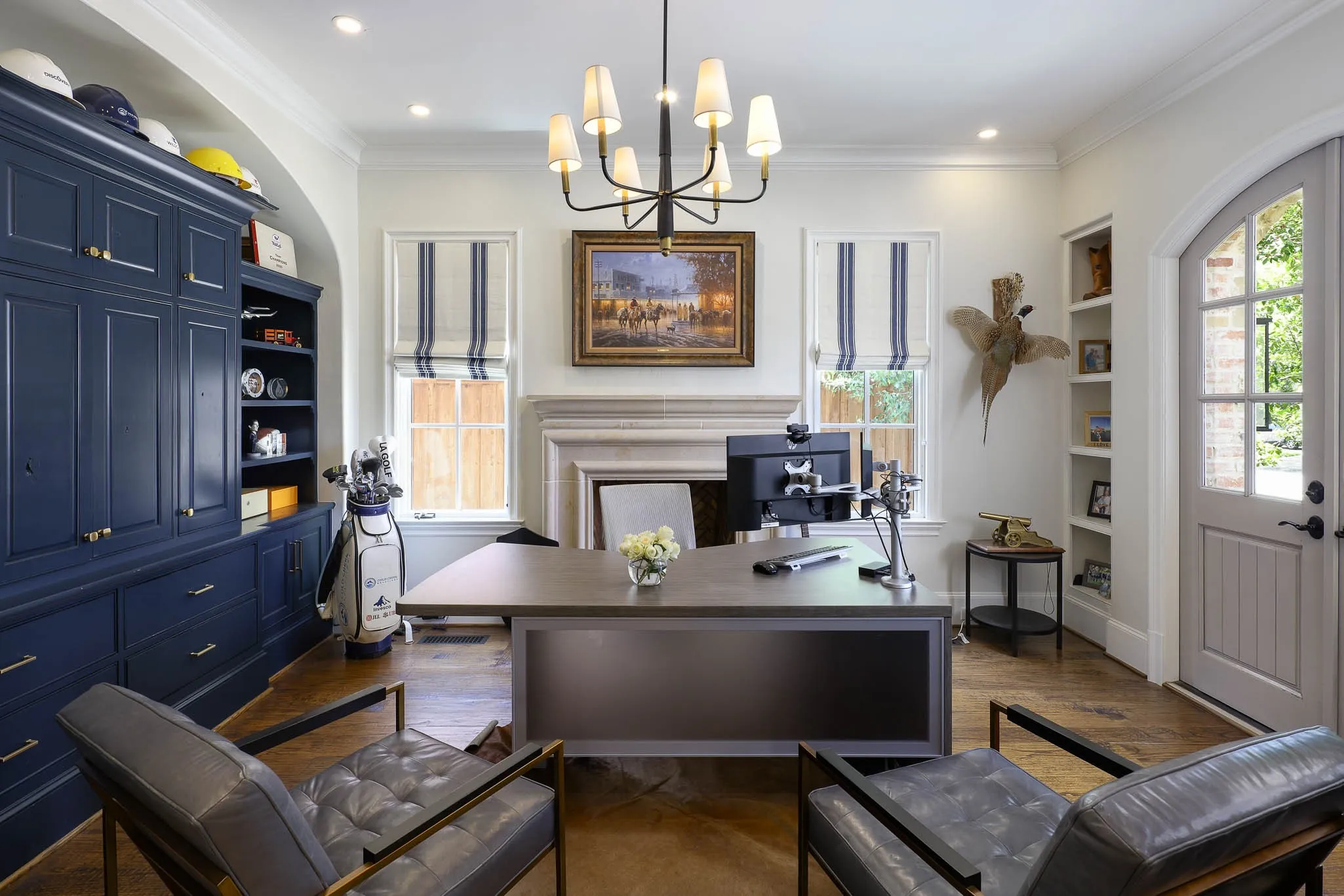 Study with gas fireplace, built-in cabinetry and access to front patio