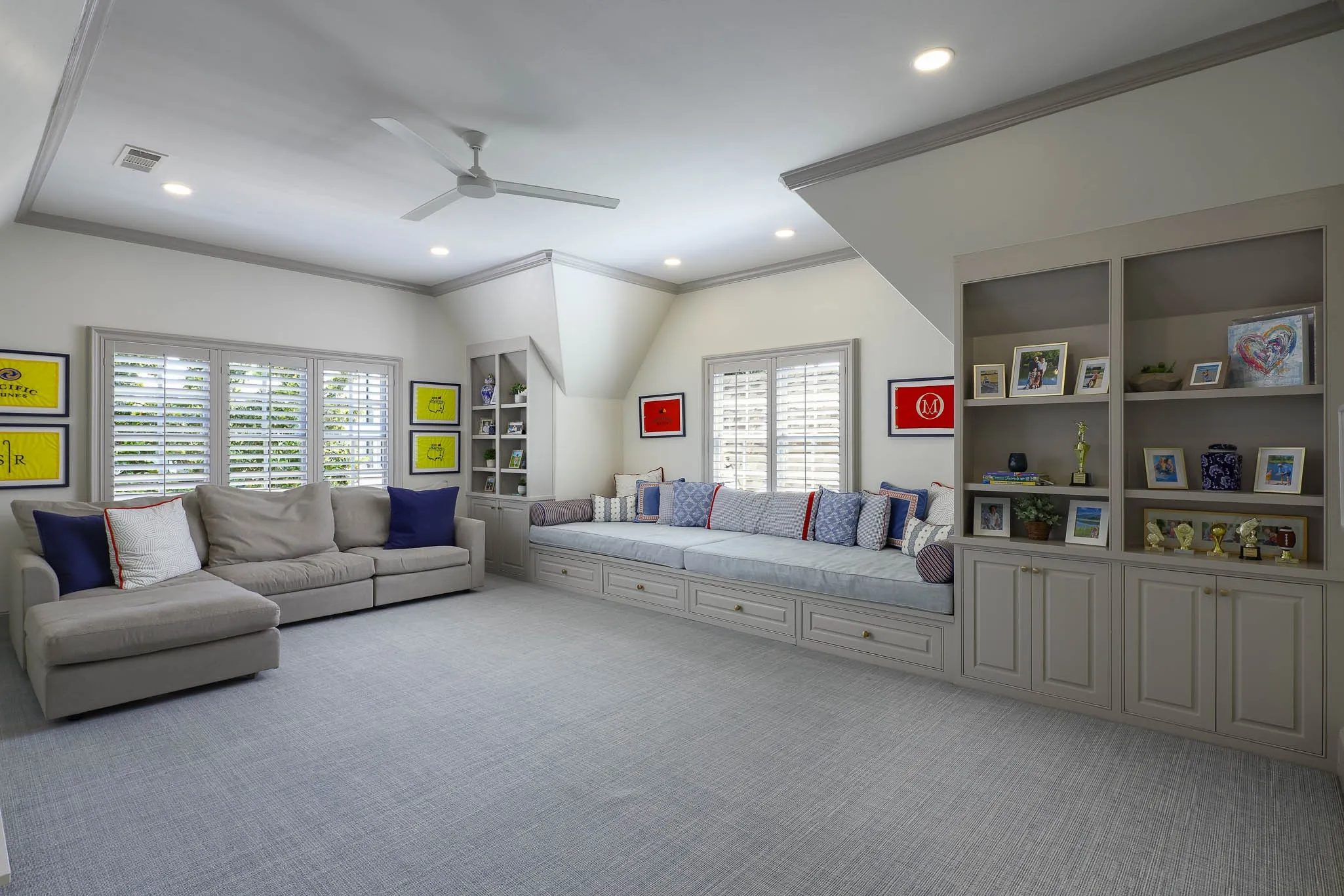 Playroom with oversized built-in window seat overlooking backyard and wet bar