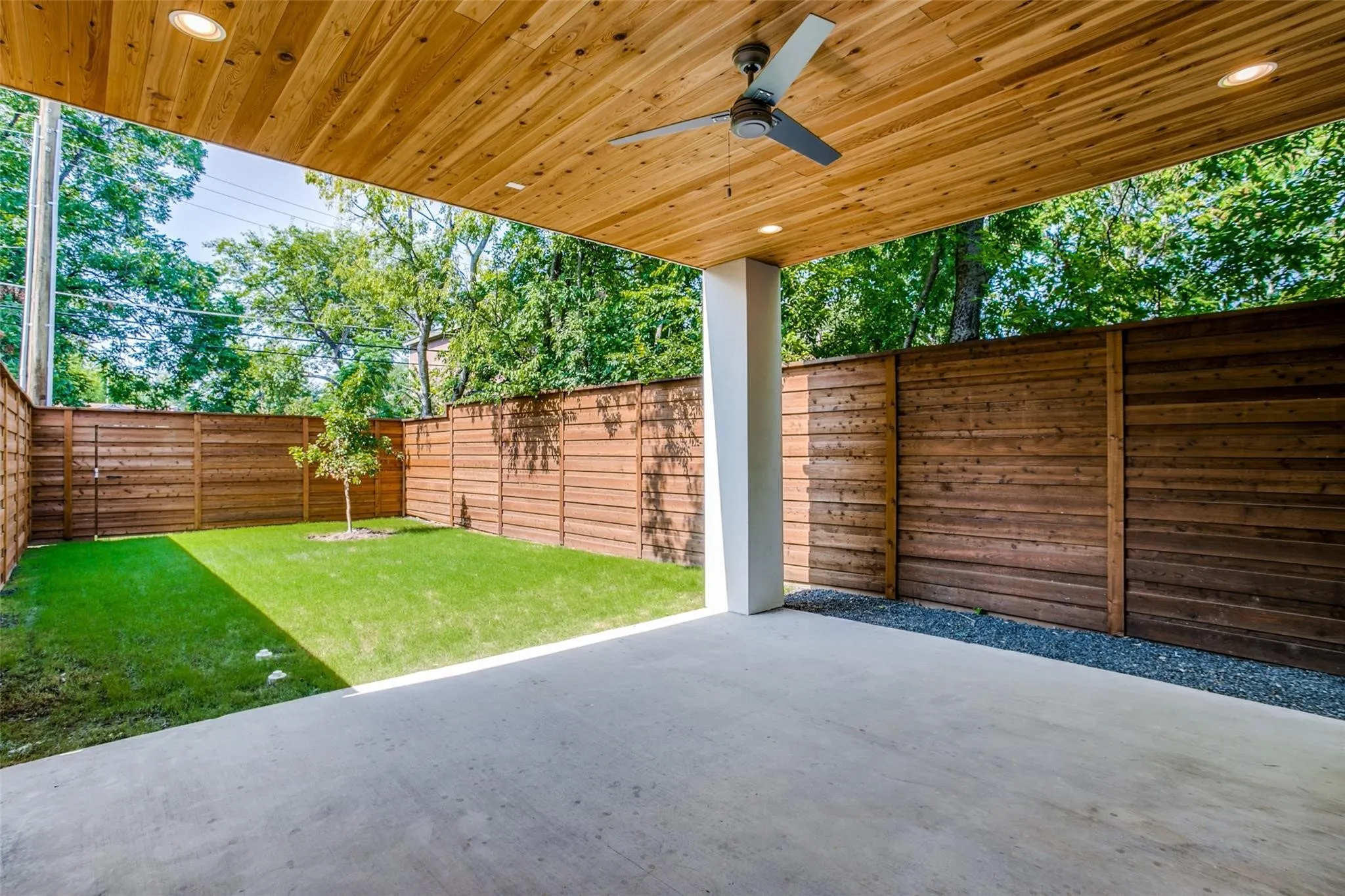 This yard now features artificial turf and patio has charcoal epoxy finish. Easy maintenance and superior look.