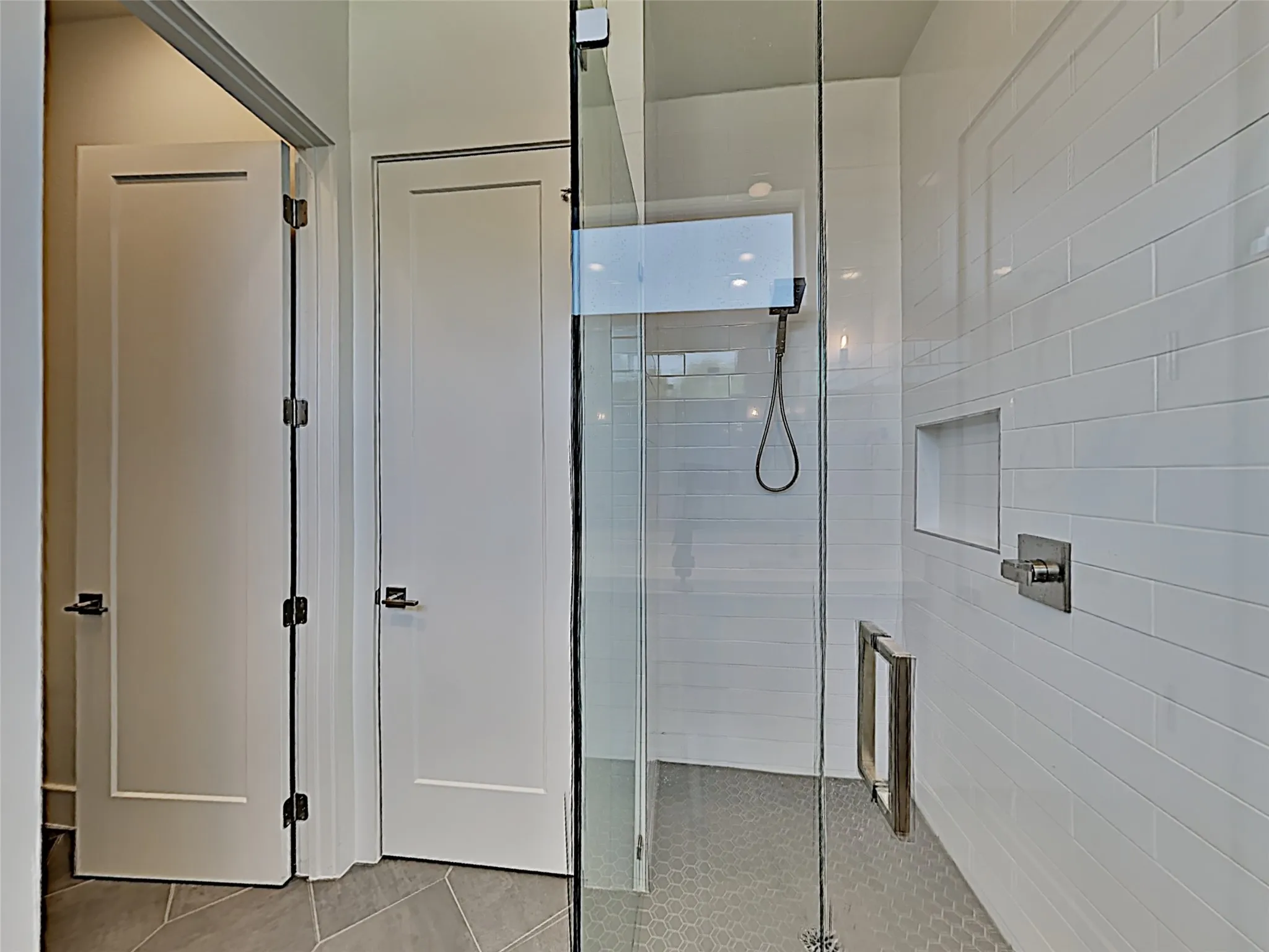 Separate shower in ensuite to two bedrooms.