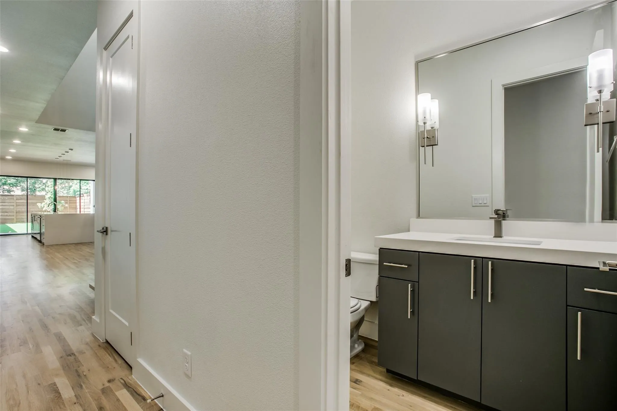 Half bath on first floor adjacent to bedroom/office.