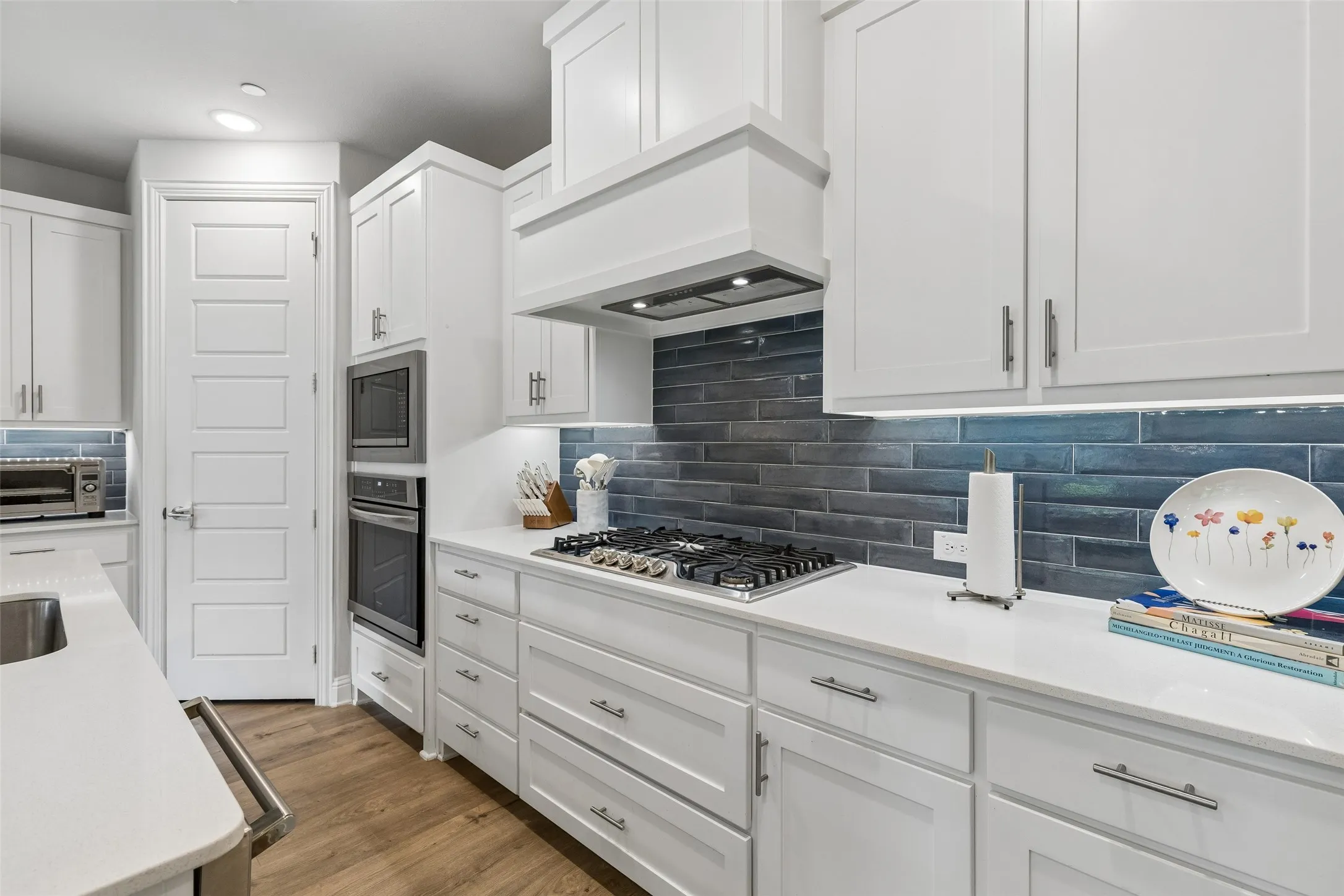 Upgraded wall oven package and deep drawers under cooktop