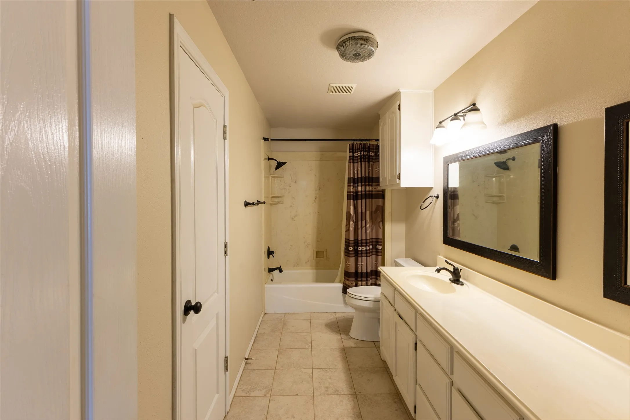 Guest Bathroom has double sinks, great counter space, and a combo shower/bath!