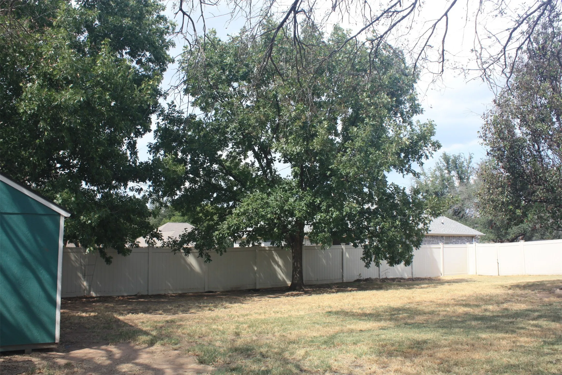 Great trees give a partially- shaded yard.