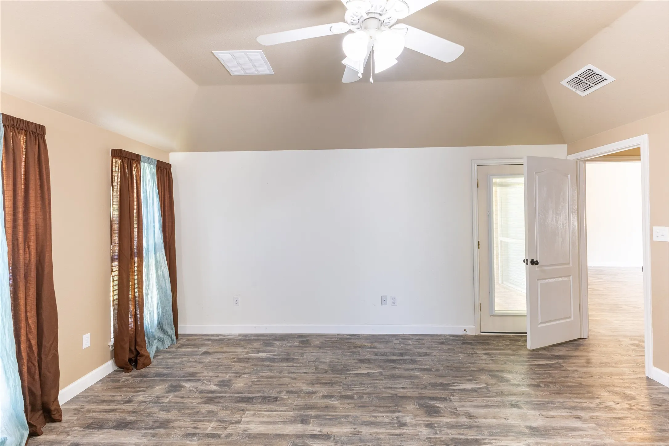 Bedroom has door leading to patio.