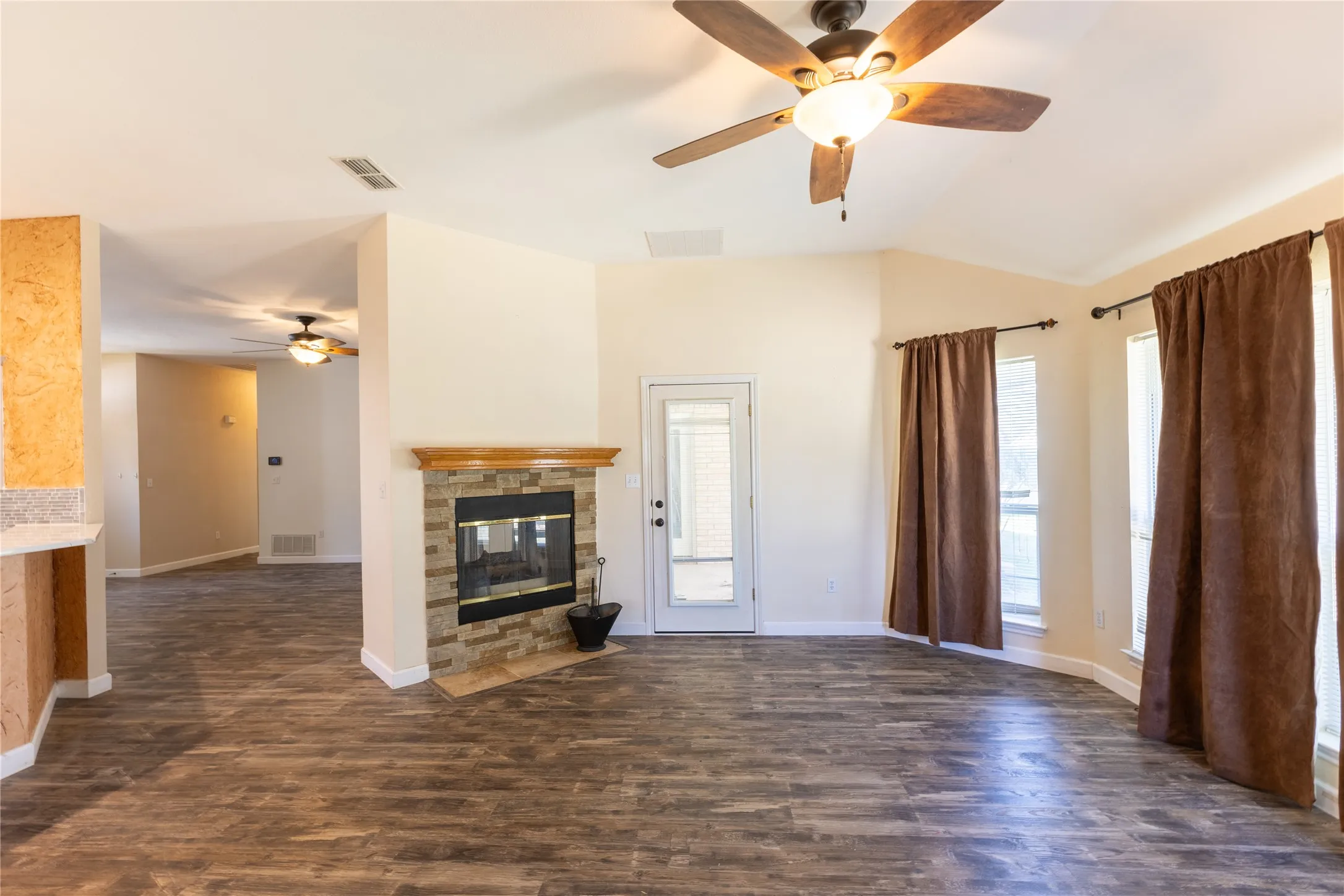 Den leads to patio. and living room