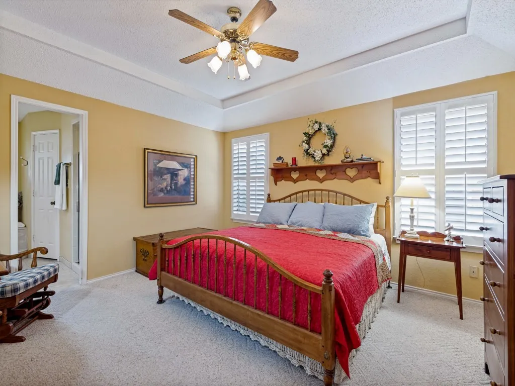 Spacious primary bedroom with Ensuite bath. Notice the plantation shutters for a custom feel.