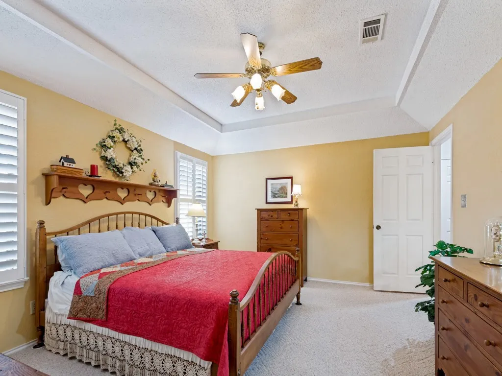 Lots of wall space for furniture placement in this primary bedroom.