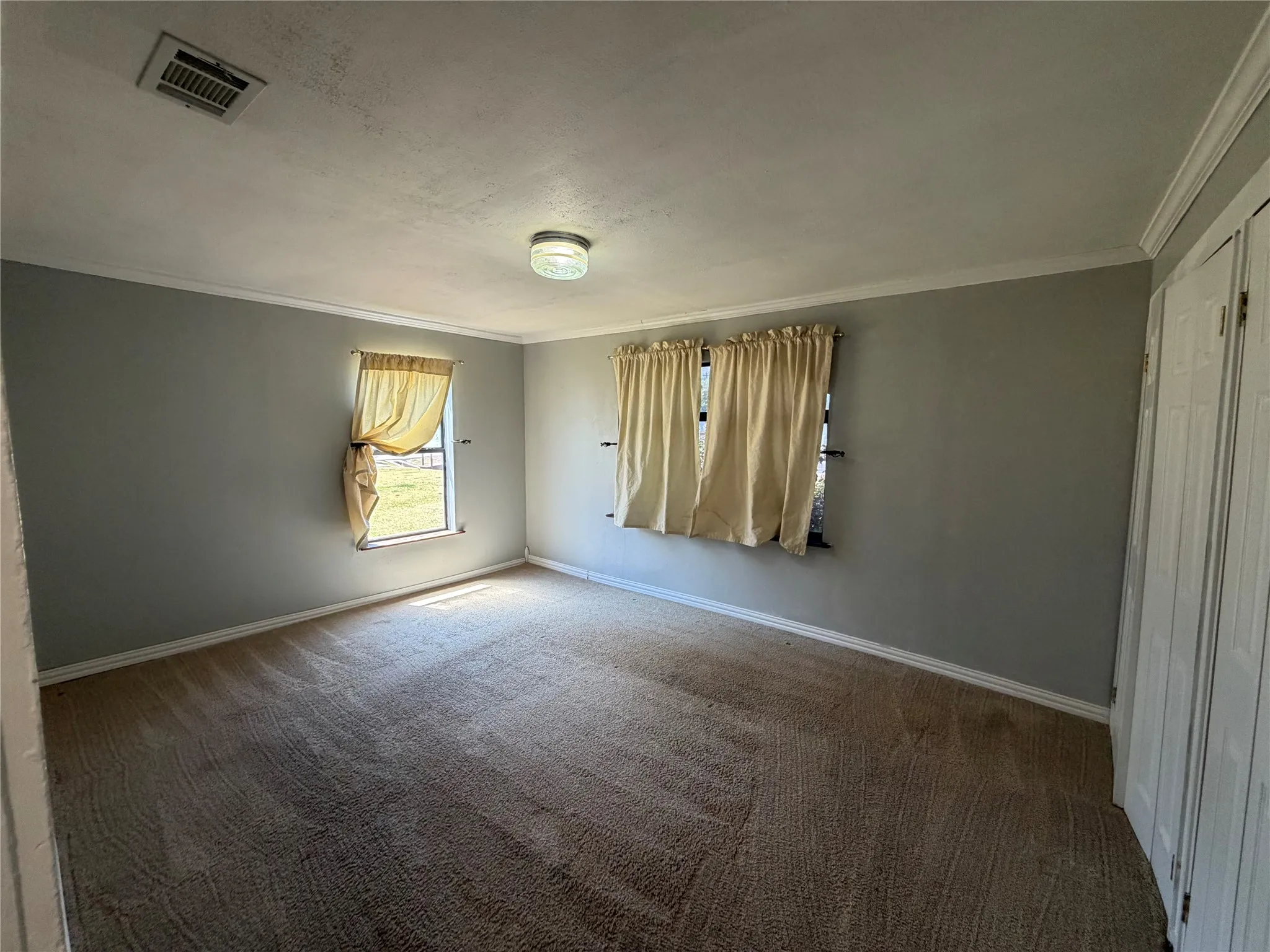 Secondary bedroom with carpet