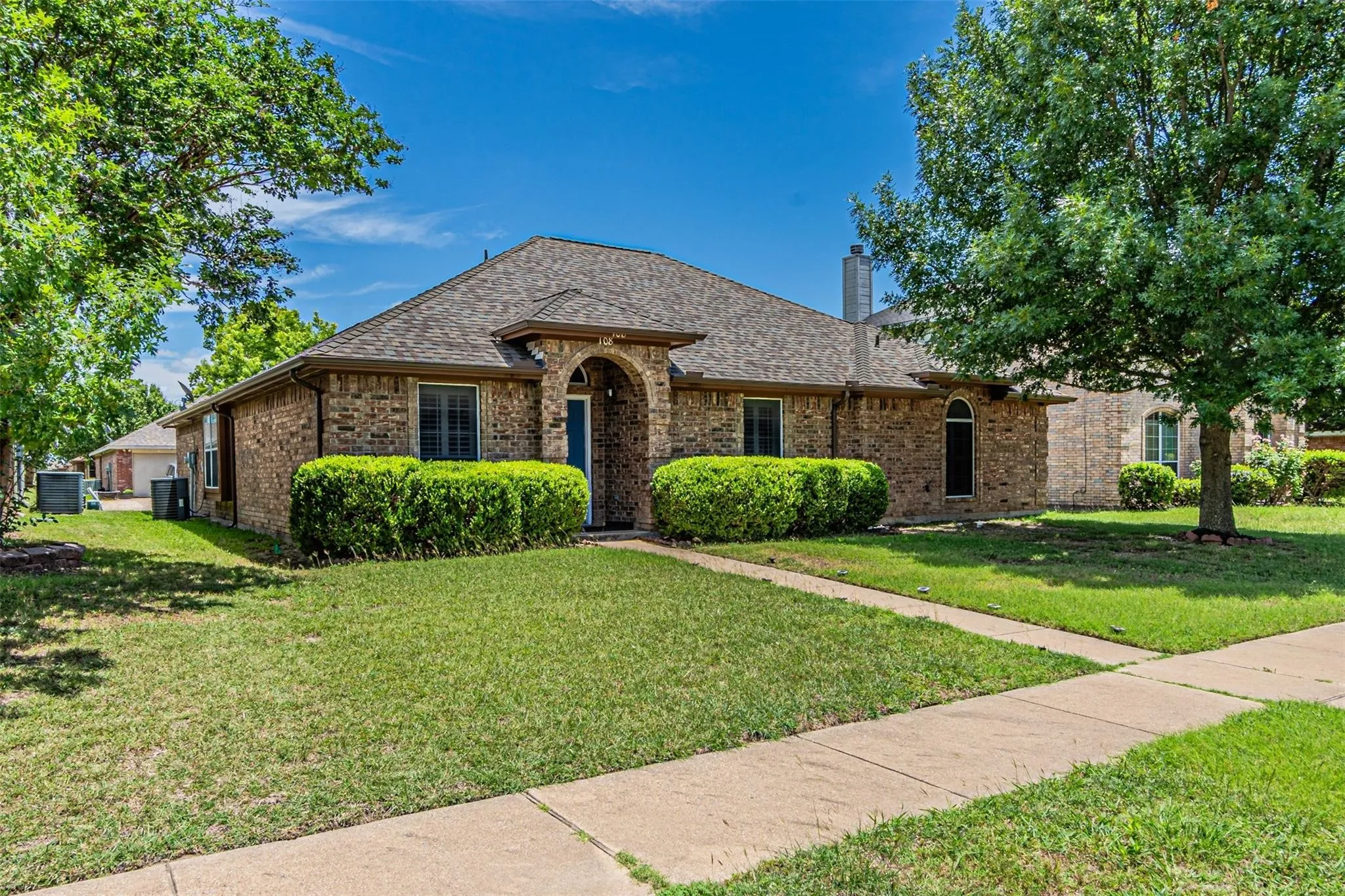 Brick exterior with arched entry