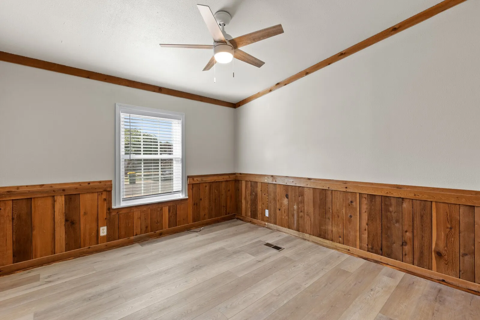 Wood-finish flooring with wood paneling accents