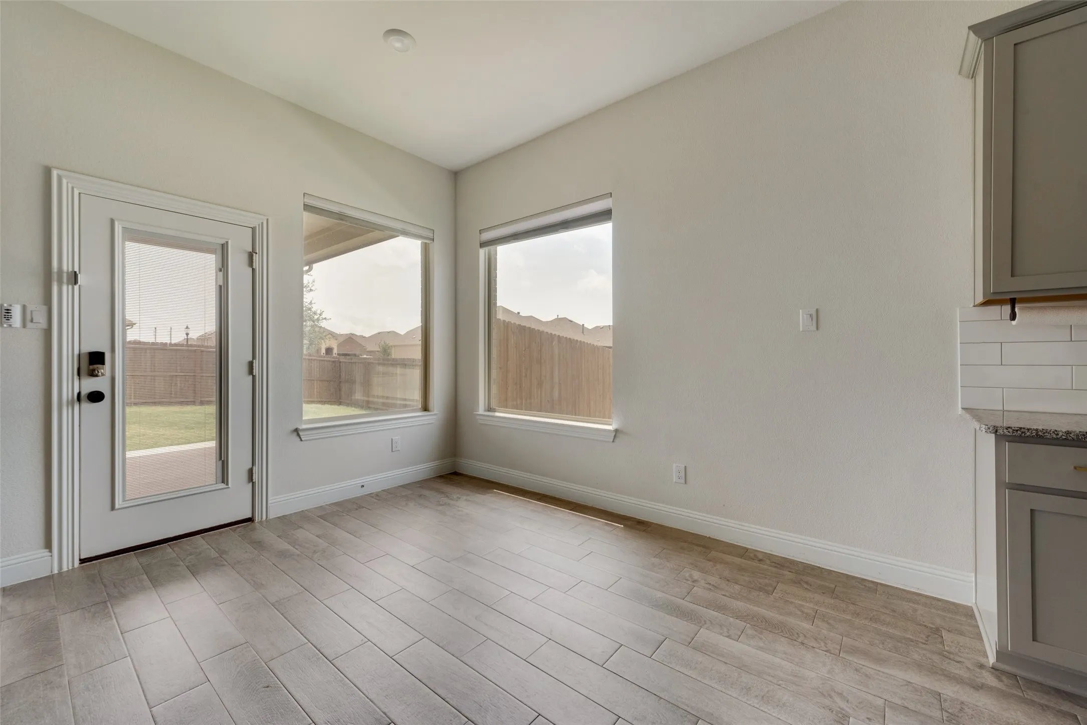 Unfurnished dining area with light wood-type flooring