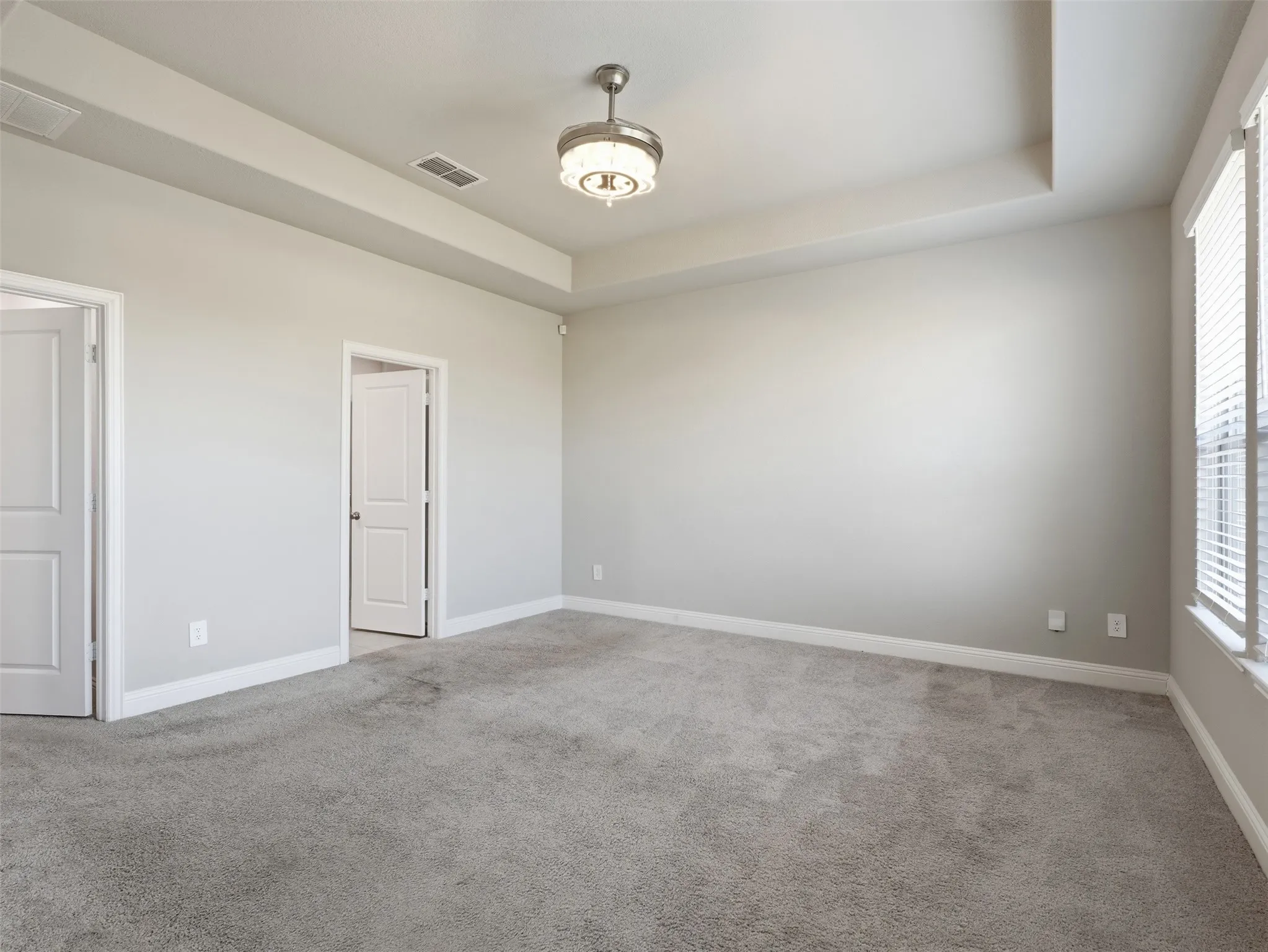 Primary bedroom with carpet