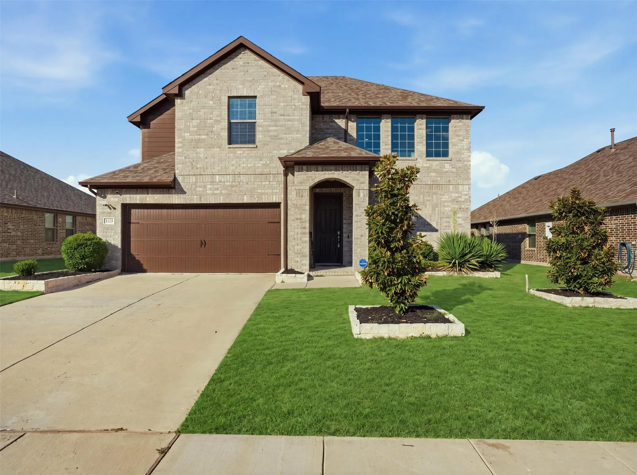 Brick exterior with wood-finish siding accents