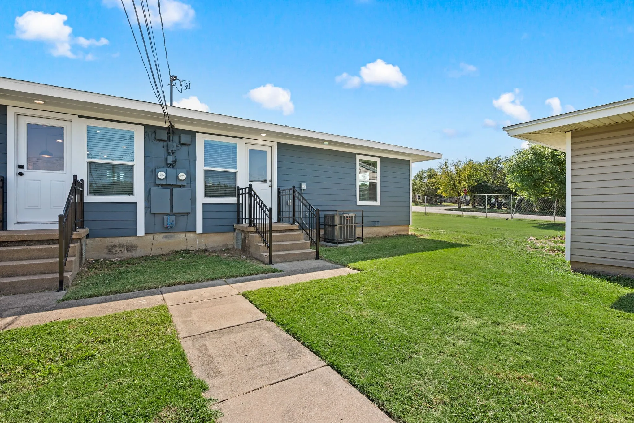 Sidewalks; Stoop; Grass aplenty in common areas