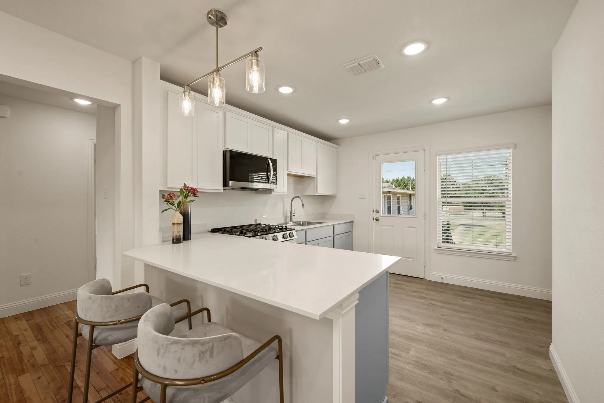 Kitchen has Luxury Vinyl Plank; Quartz countertops; Counter-height dining; Breakfast nook in corner