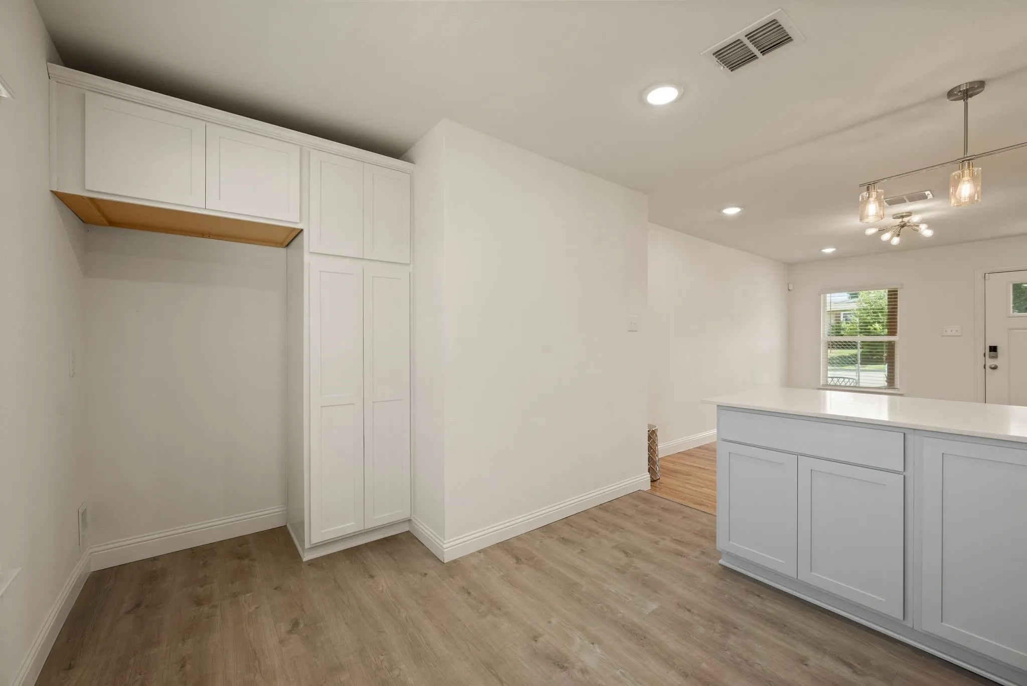 Cabinets to right of Fridge space is a pantry! Waterline to Fridge; Designer Lighting