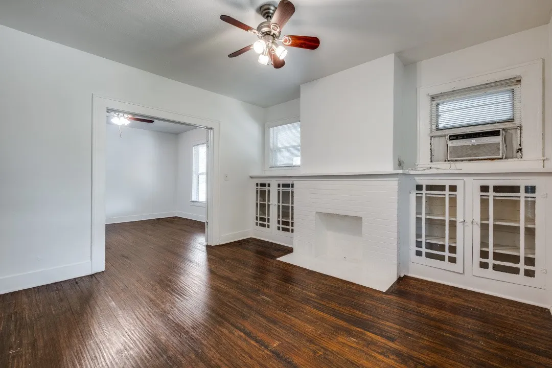 Wood-finish flooring throughout, complemented by a ceiling fan