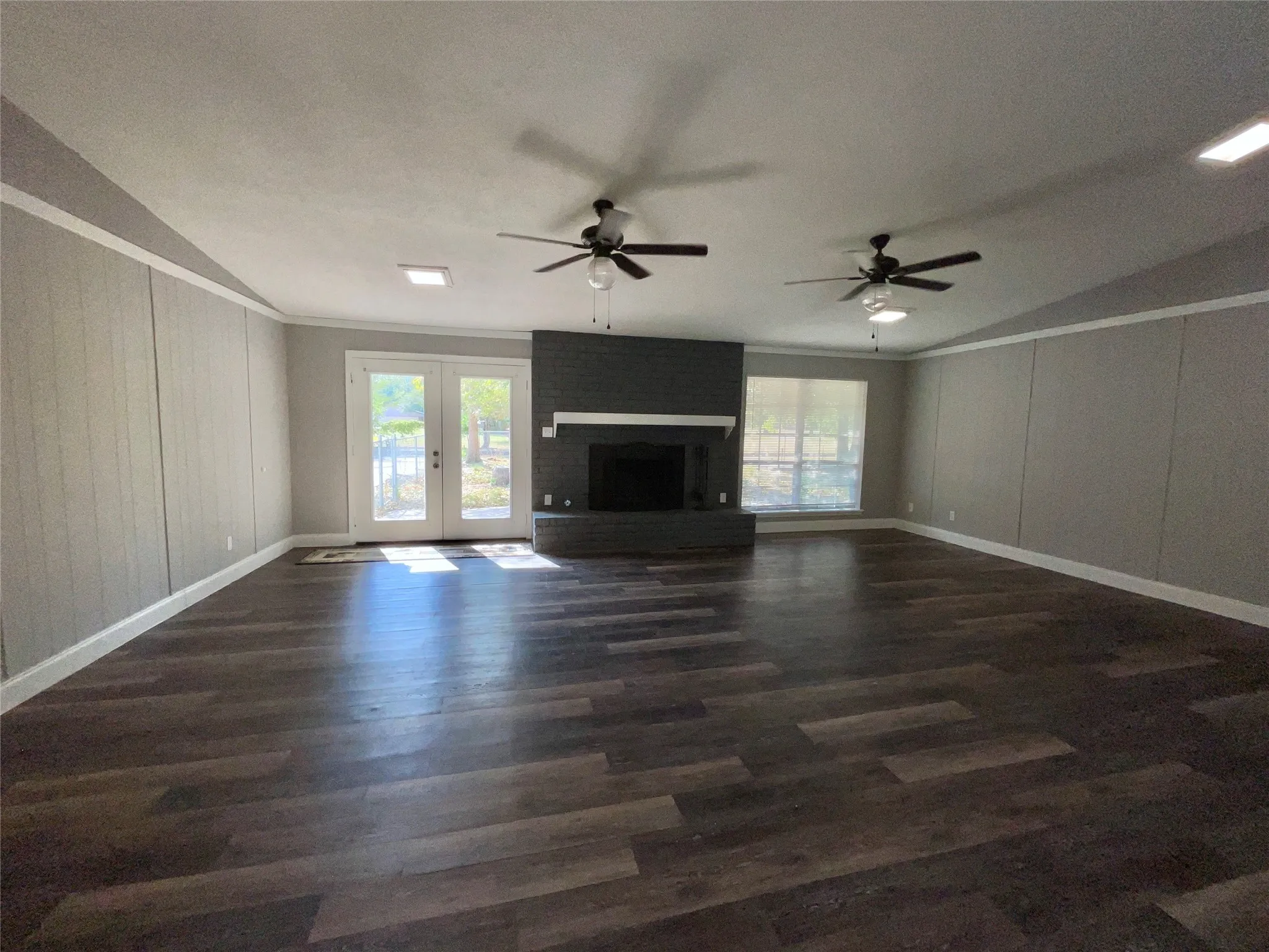 Open Floor Plan Featuring a Spacious Living Room with Beautiful Fireplace and Built-In China Hutch
