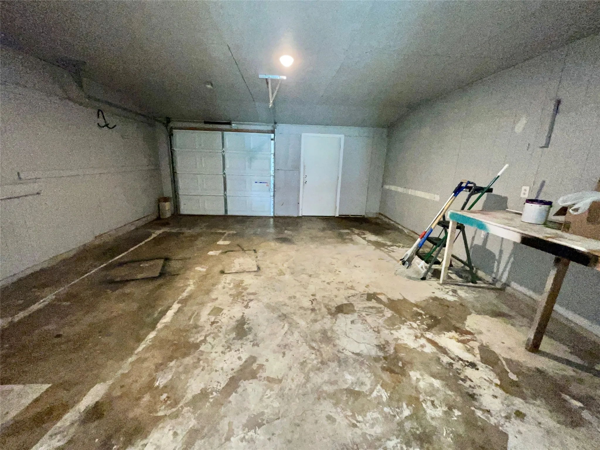 Interior of Garage. Garage features storage closet.