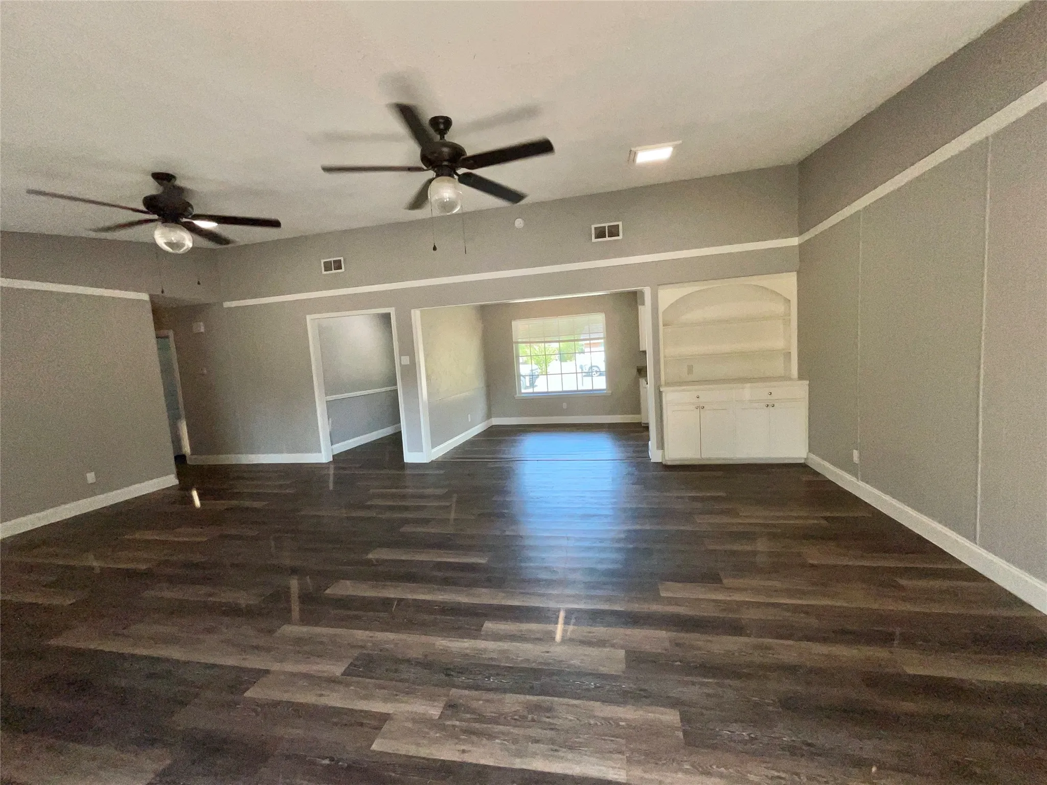 Open Floor Plan Featuring a Spacious Living Room with Beautiful Fireplace and Built-In China Hutch