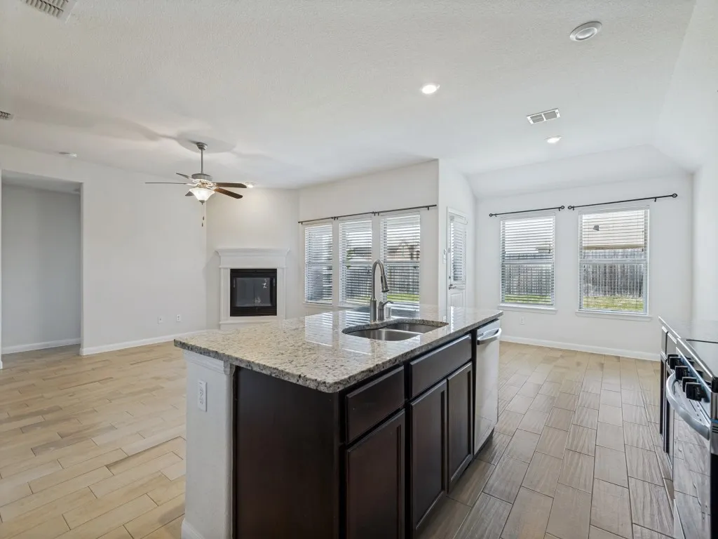 Kitchen island with granite countertop and double basin sink