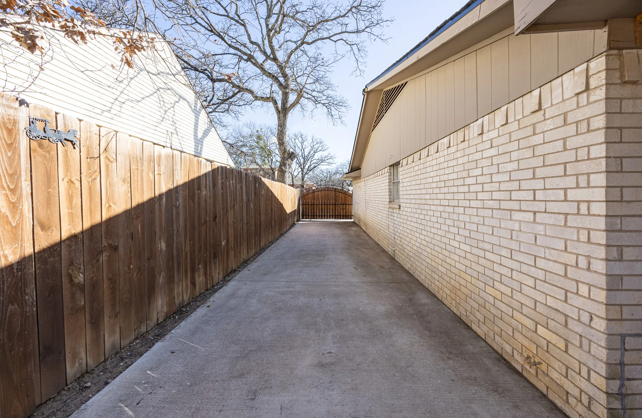 Driveway all the way to the rear of the home