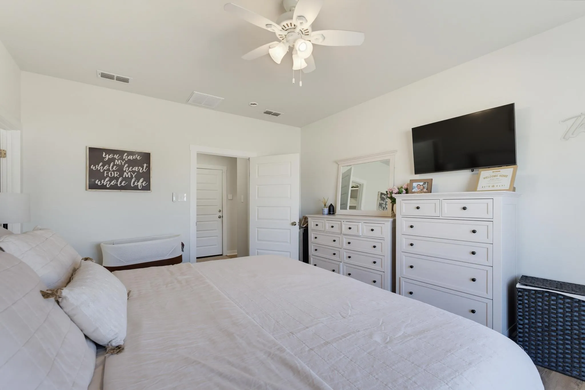 White walls, ceiling fan with light, recessed lighting, and wood-finish flooring