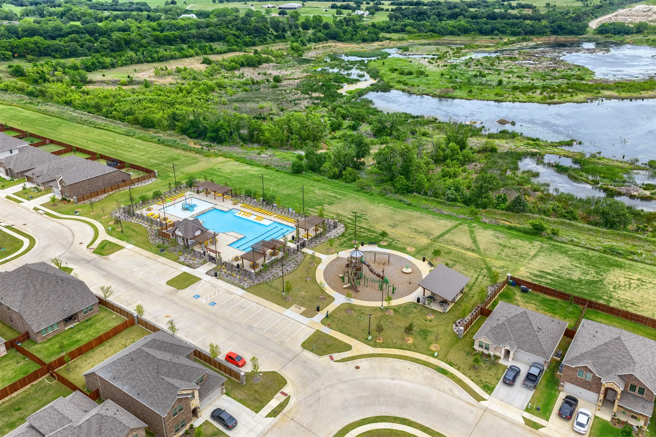 Community amenities featuring a swimming pool, covered pergolas, playground, and paved walking paths